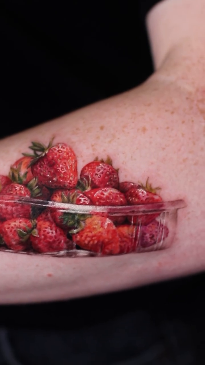 Strawberries in a plastic container realism tattoo by Eun, Toronto, Ontario