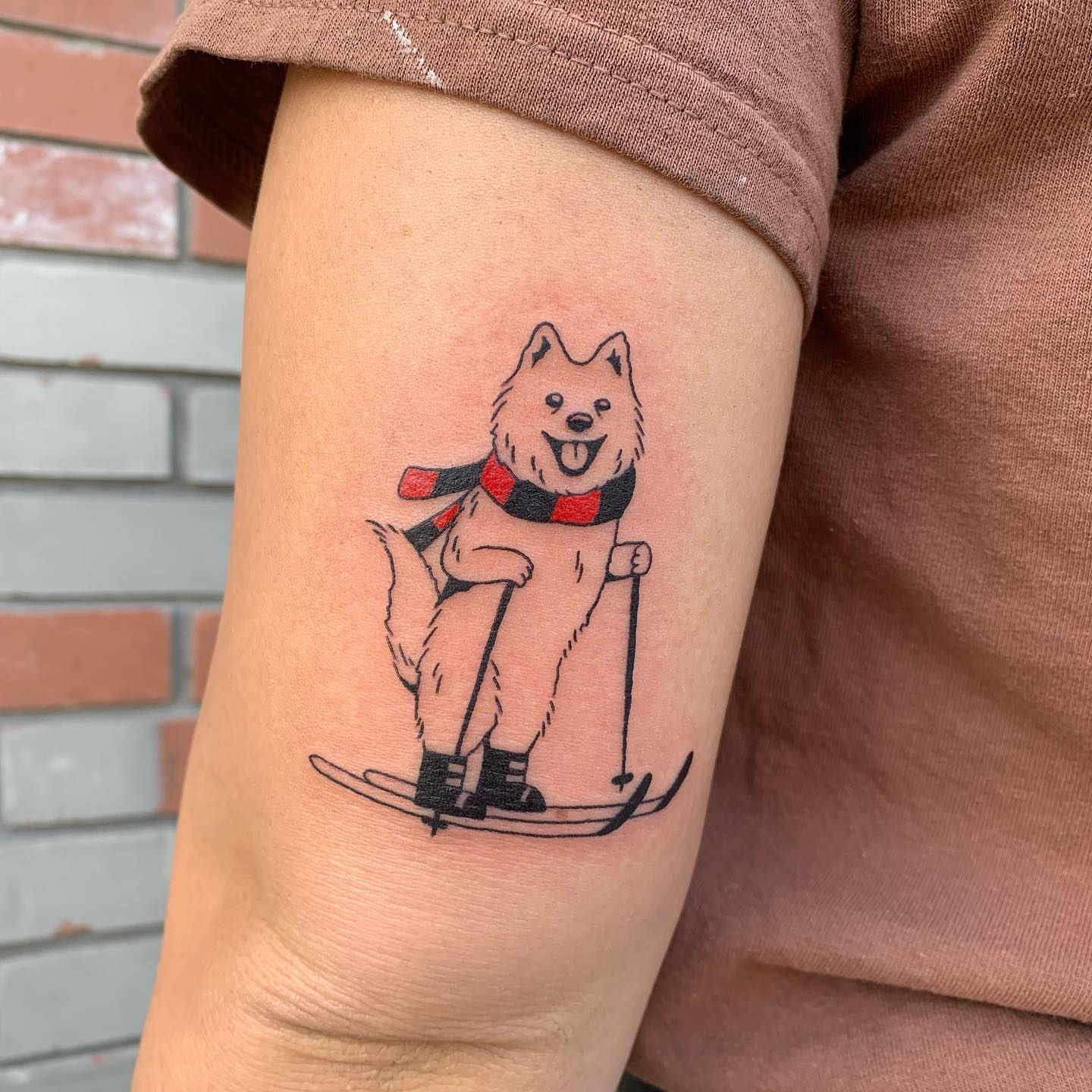 Skiing dog illustrative tattoo on the forearm by s͓̽a͓̽w͓̽n͓̽j͓̽a͓̽