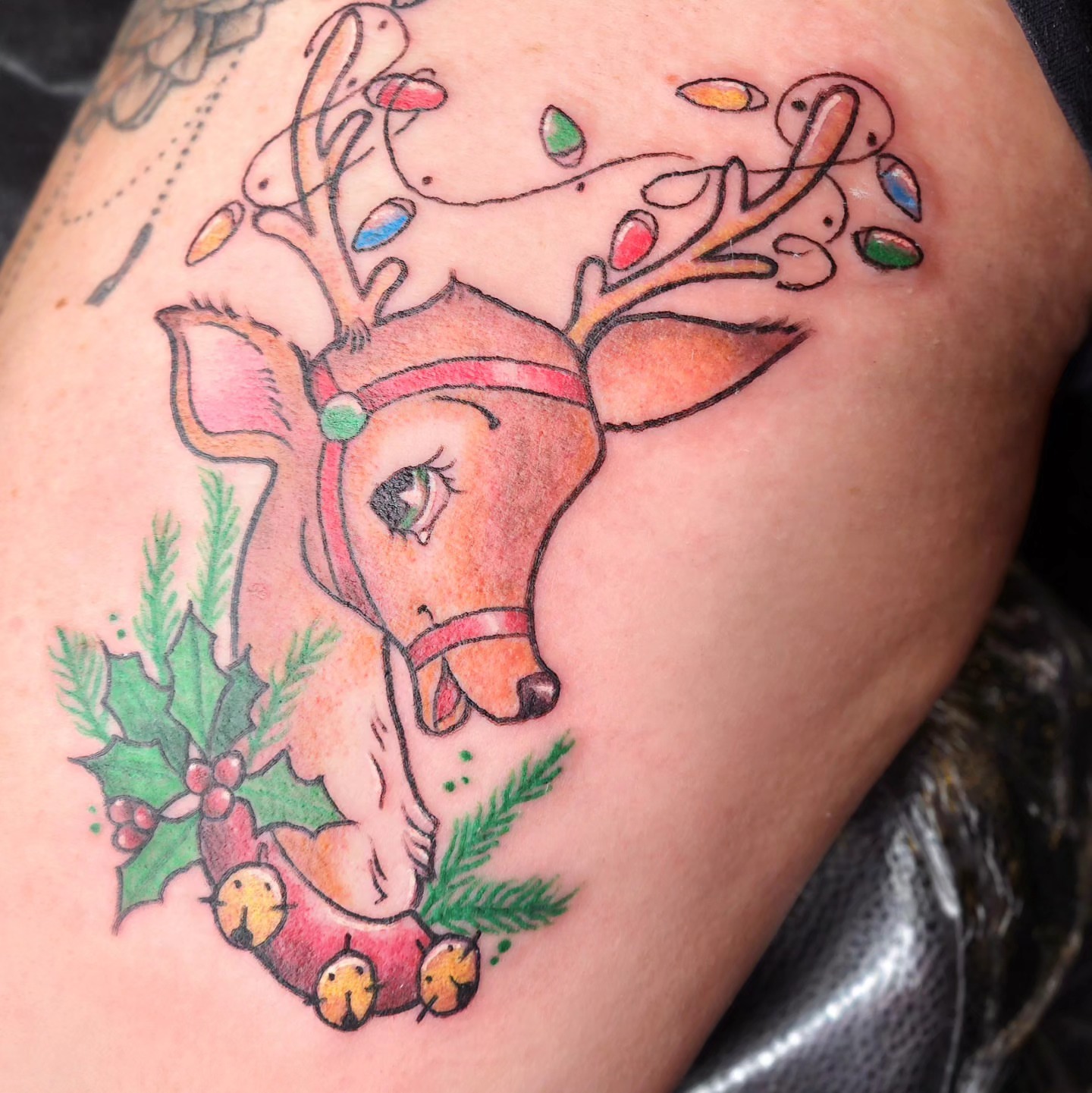 Reindeer new school tattoo on the upper arm by Audrey Luther