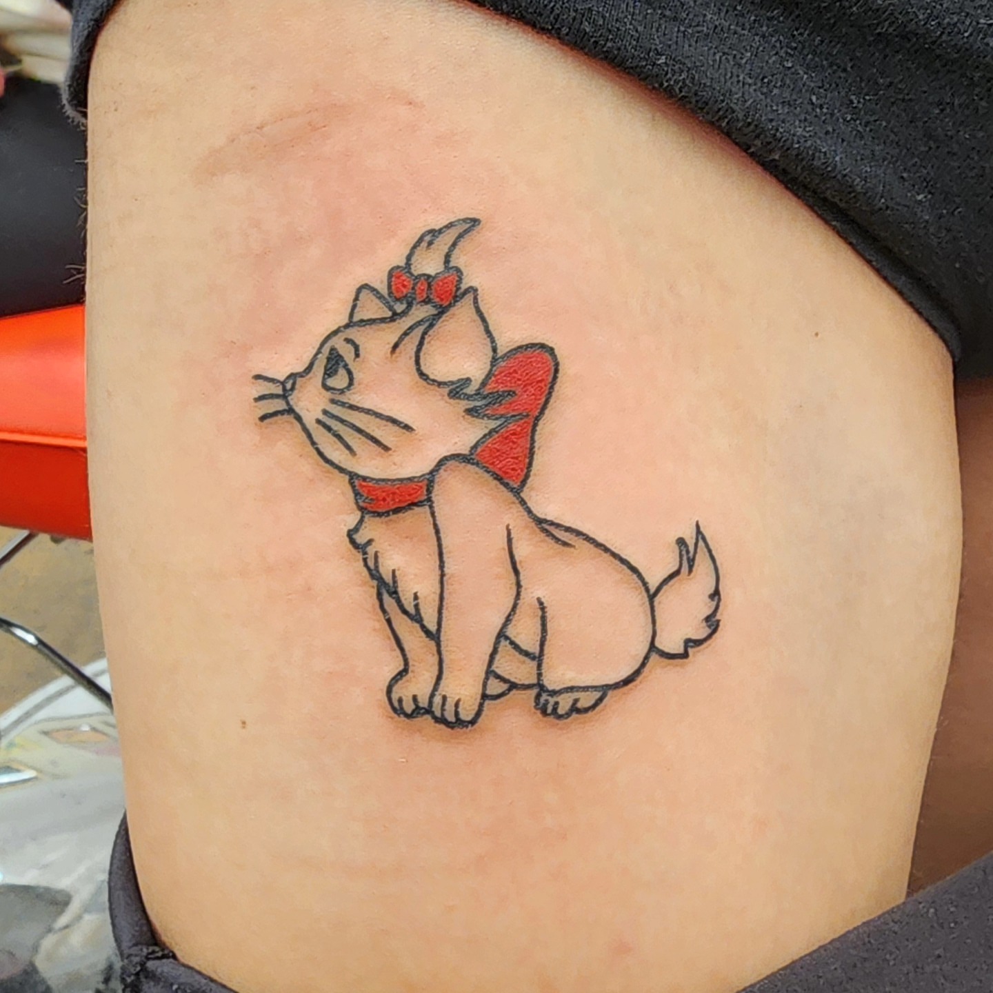 Cat illustrative tattoo on the thigh by @thedevilspaintbrush_