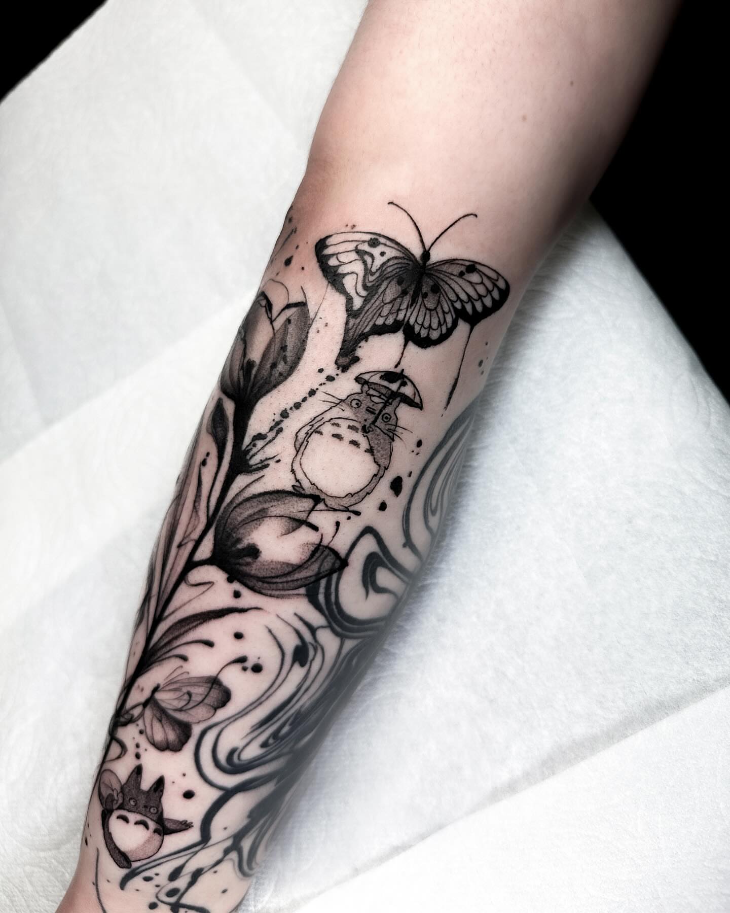 Totoro and butterfly dotwork tattoo on the forearm by Tattoos in Federal Way, WA🖤