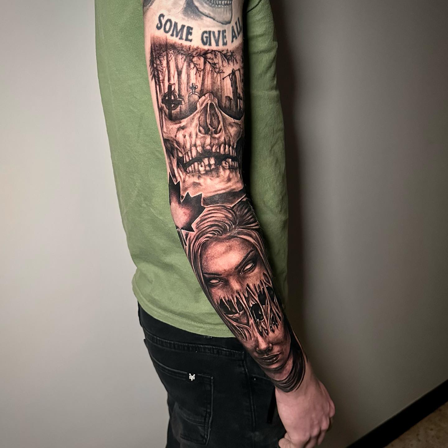 Skull and woman realism tattoo on the forearm by Megan McKee Tattoo Artist