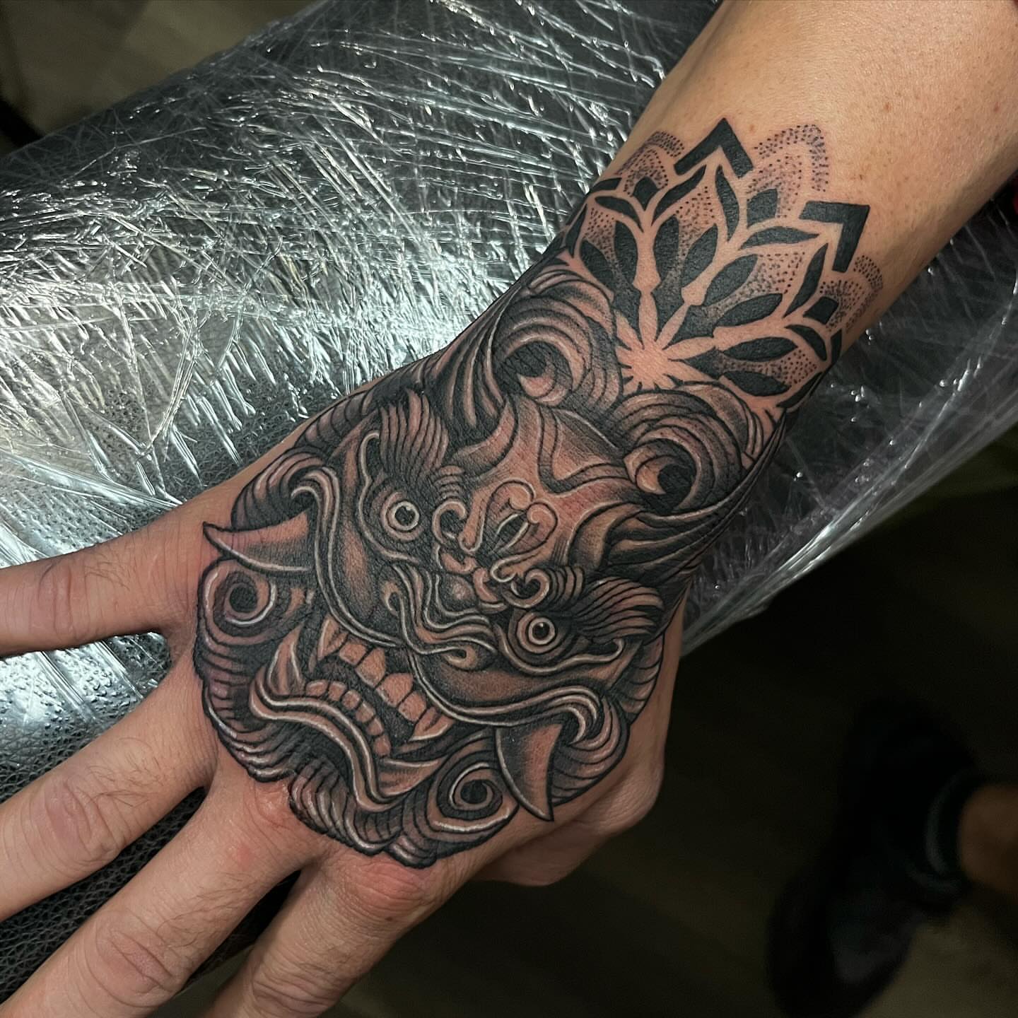 Mask japanese irezumi tattoo on the forearm by Christopher McGlone