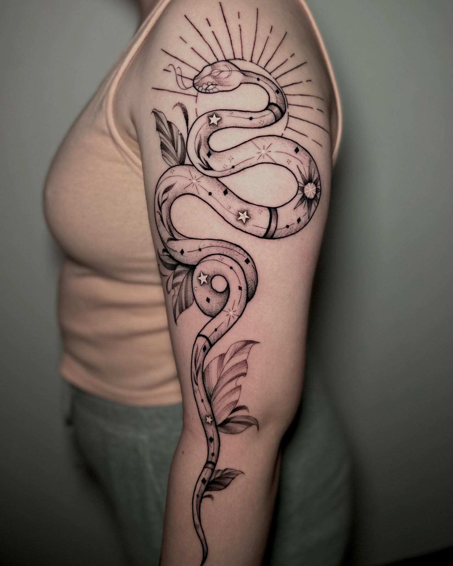 Snake black and grey tattoo on the forearm by Bradi