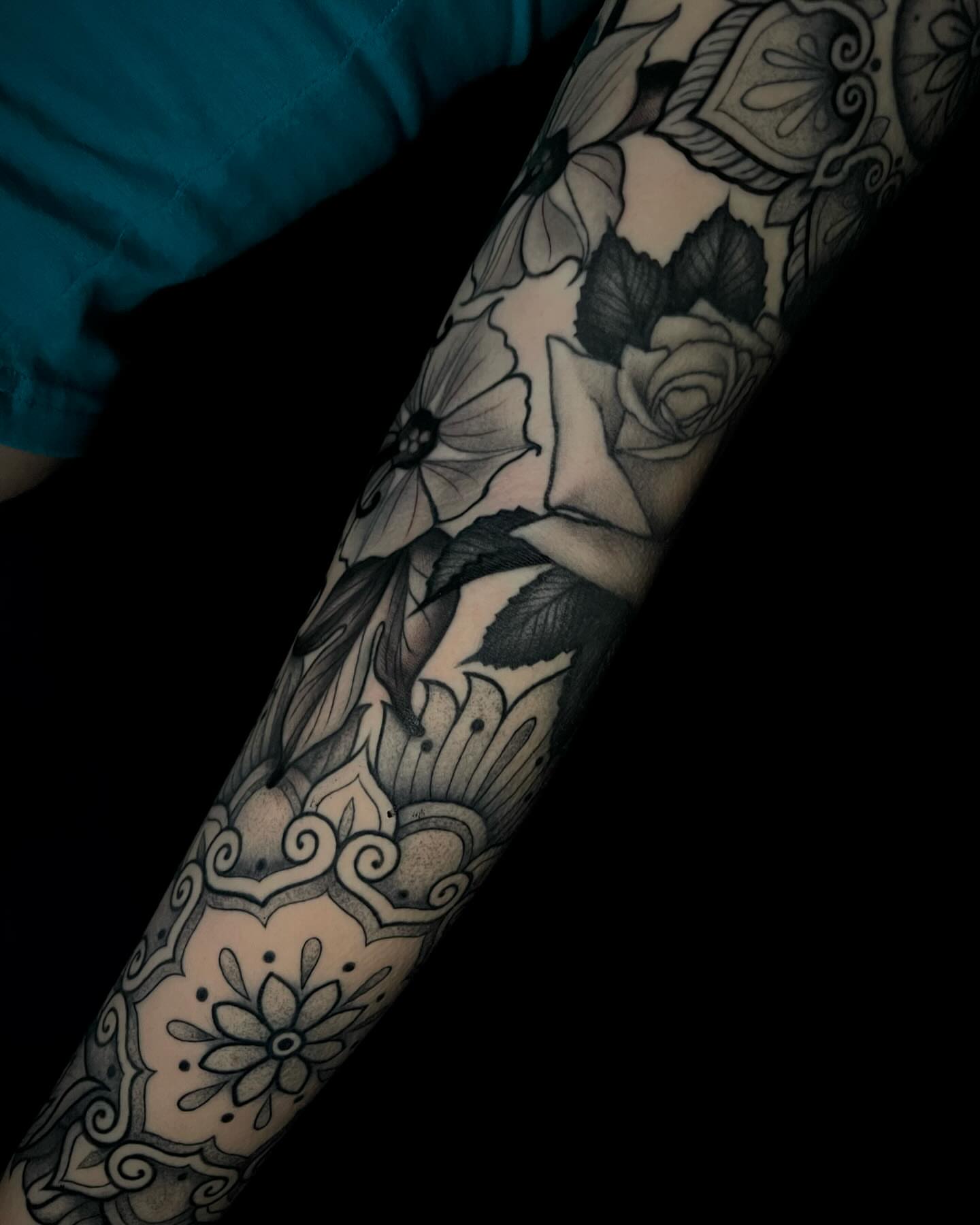 Floral pattern ornamental tattoo on the forearm by Amber