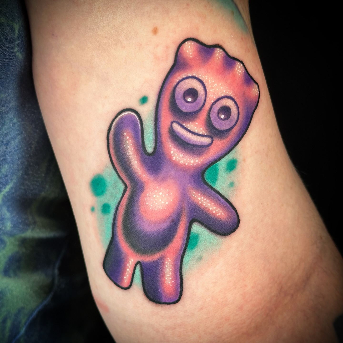 Alien watercolor tattoo on the forearm by B.G. Germershausen