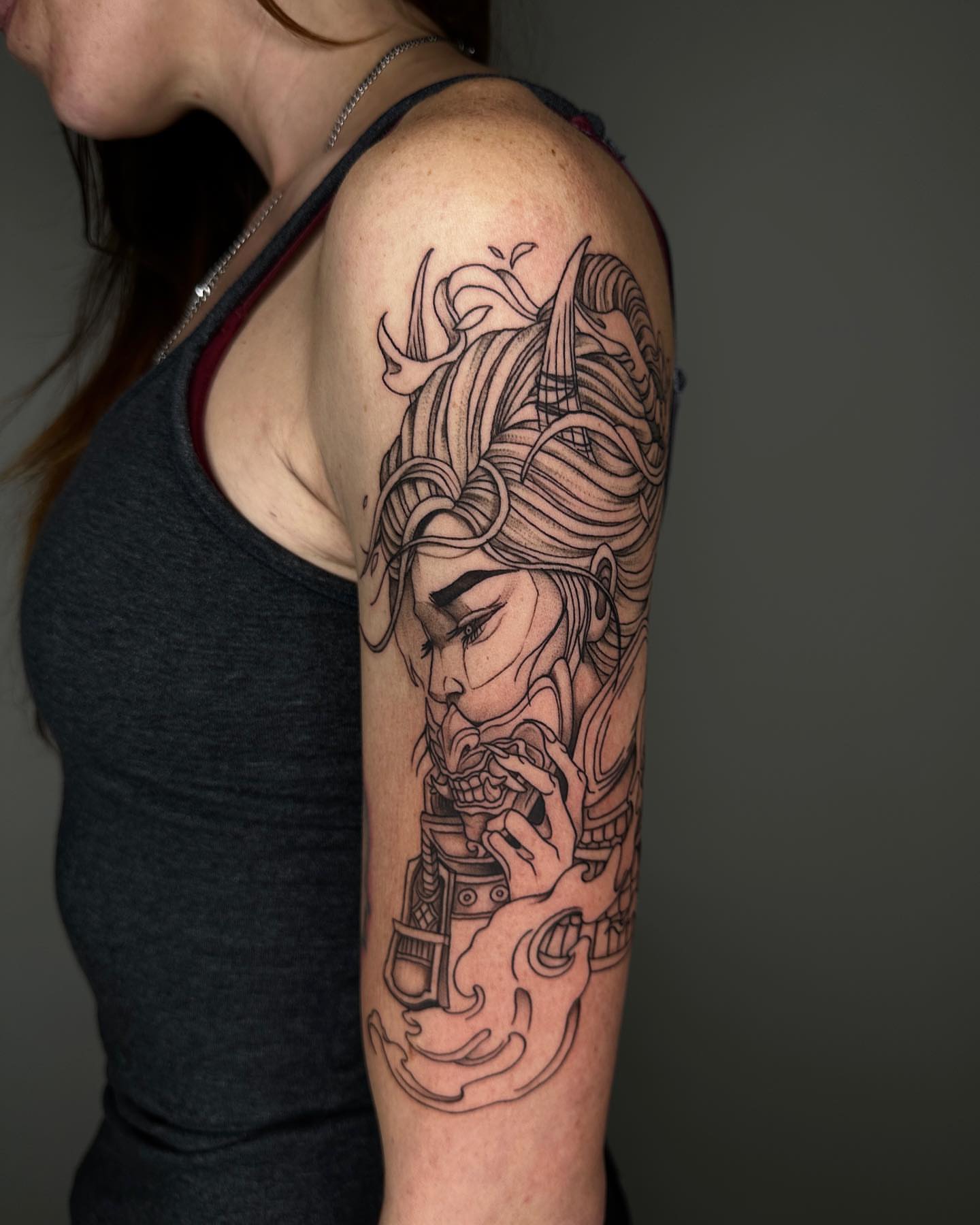 Woman with intricate headdress fine line tattoo on the shoulder by A L e X
