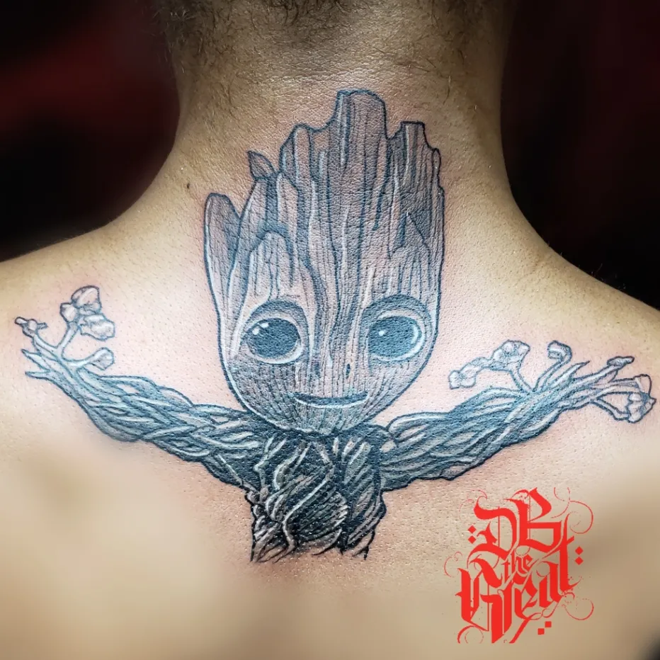 Groot black and grey tattoo on the neck by Dannie Blythewood