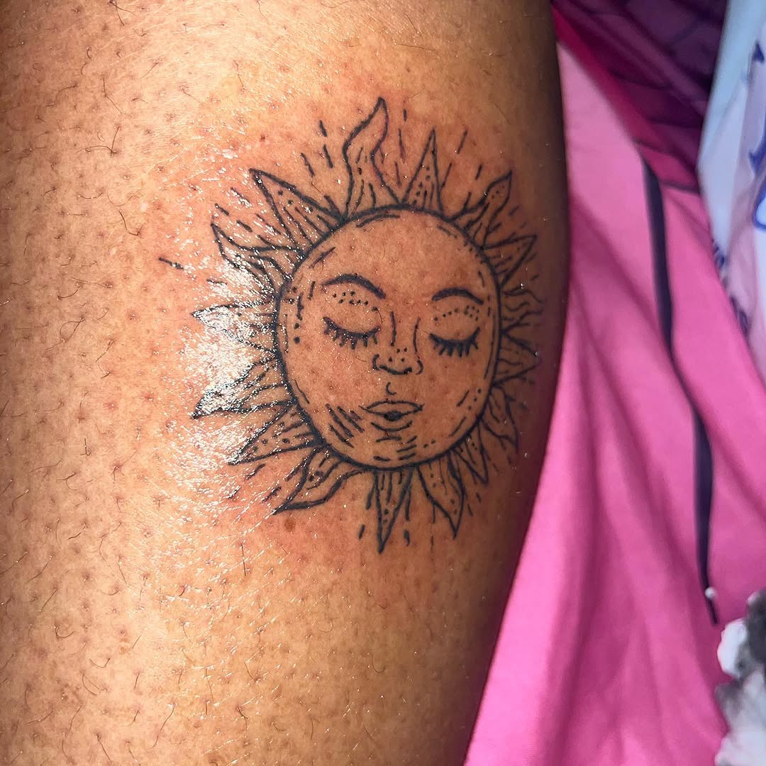 Sun face ornamental tattoo on the leg by Eunoia Tattoos