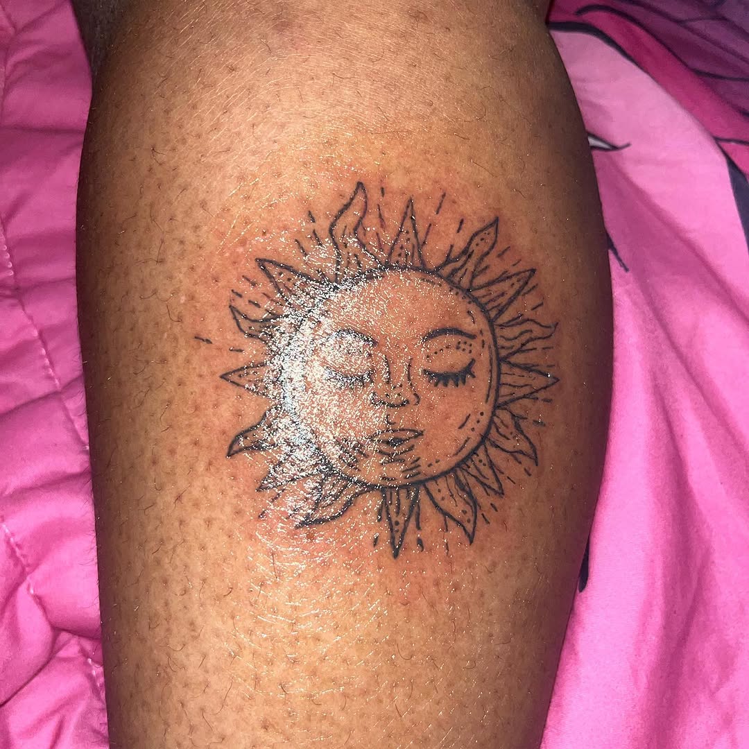 Sun face geometric tattoo on the thigh by Eunoia Tattoos