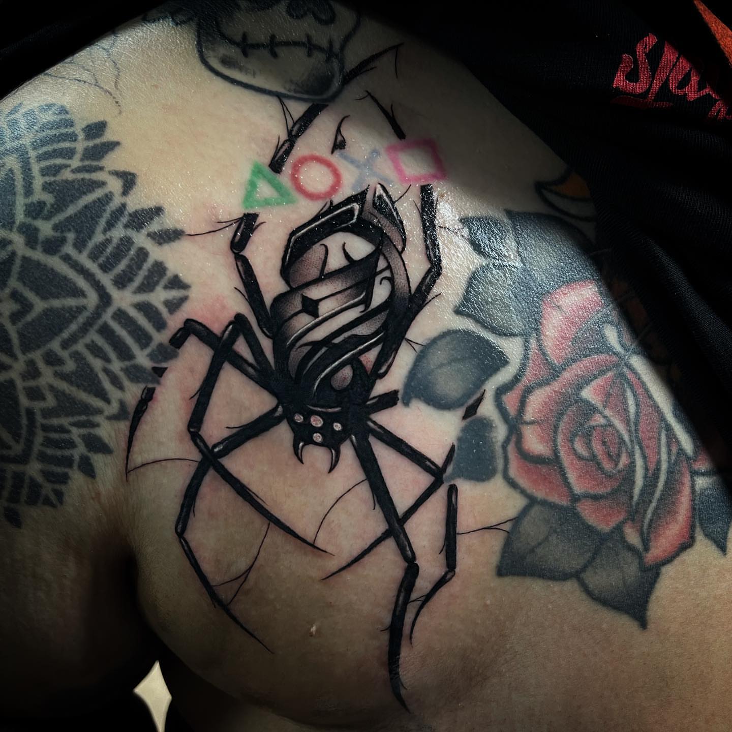 Spider blackwork tattoo on the chest by @tattoos_by_elijah