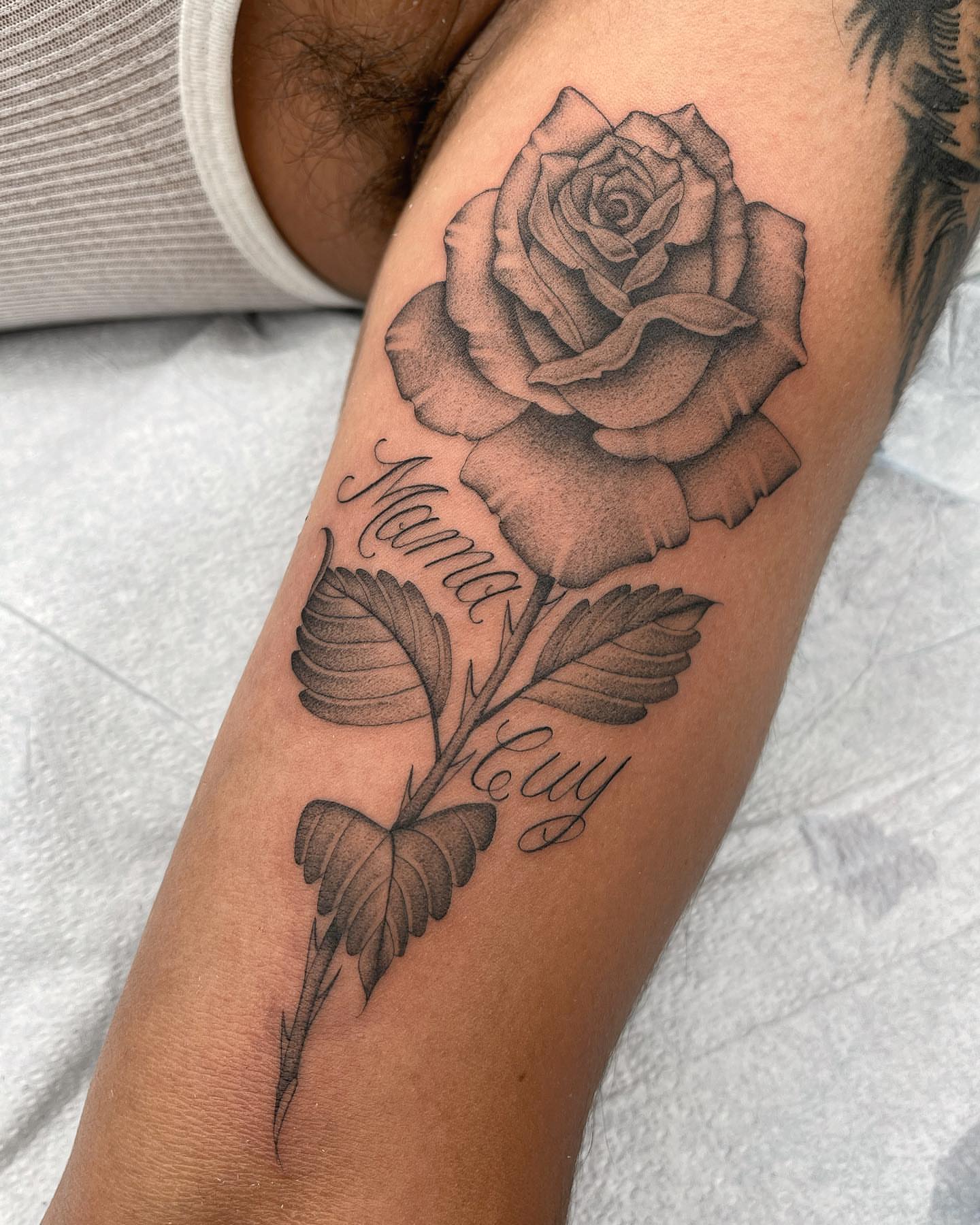 Rose black and grey tattoo on the forearm by Tiyanna Garlic