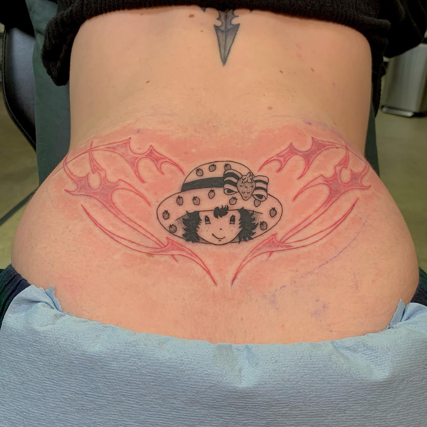 Anime character anime tattoo on the torso by Maddy Paige