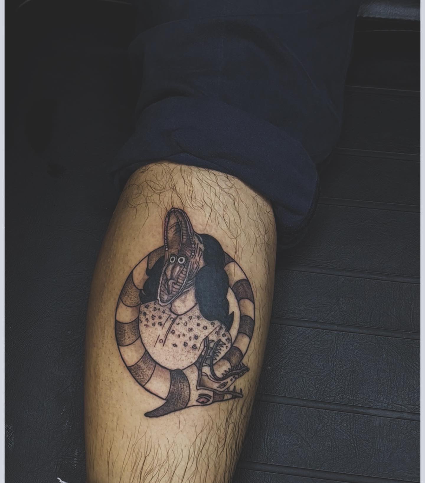 Snake and bird black and grey tattoo on the thigh by V