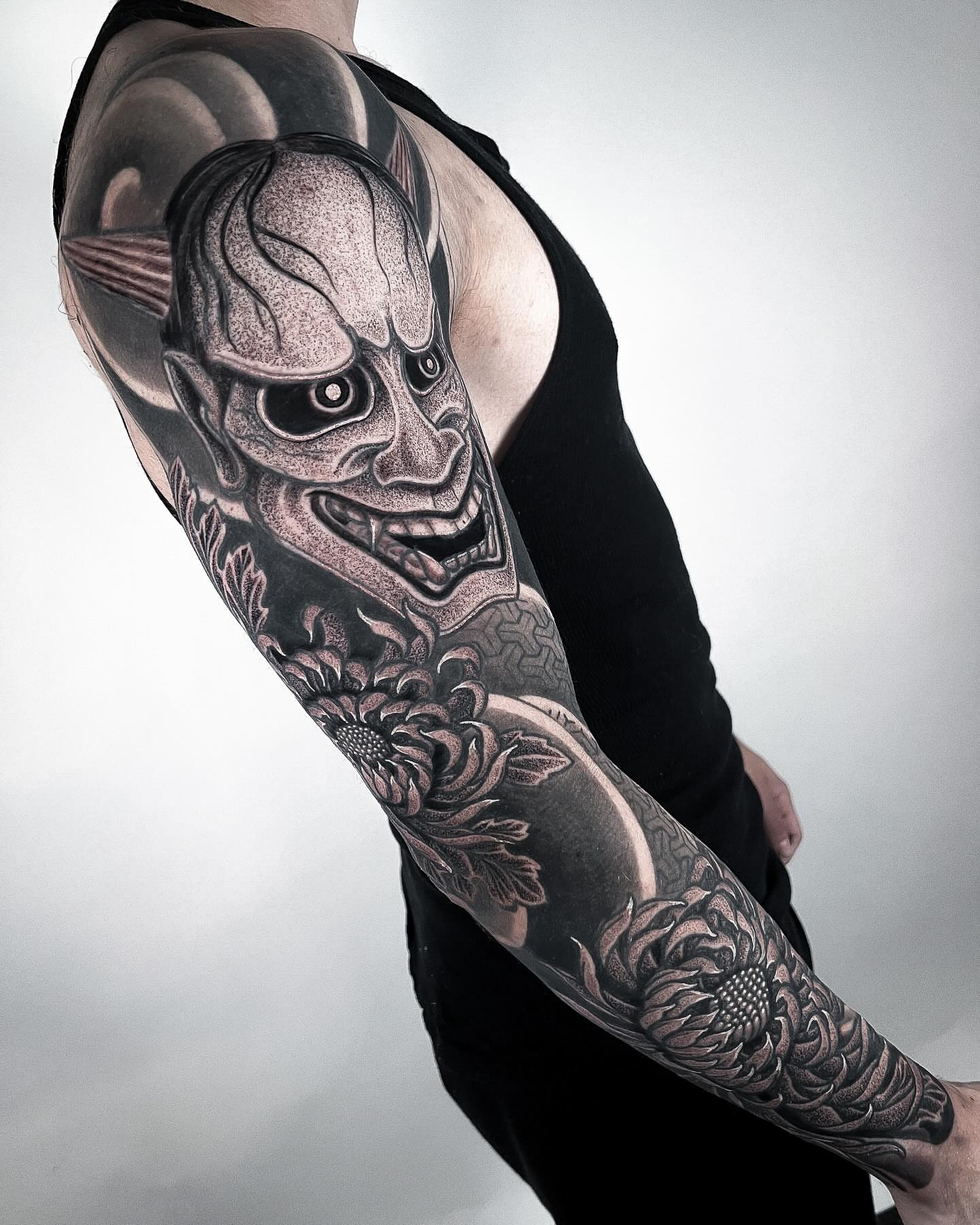 Clown mask realism tattoo on the forearm by Aries Rhysing, Wheat Ridge, Colorado