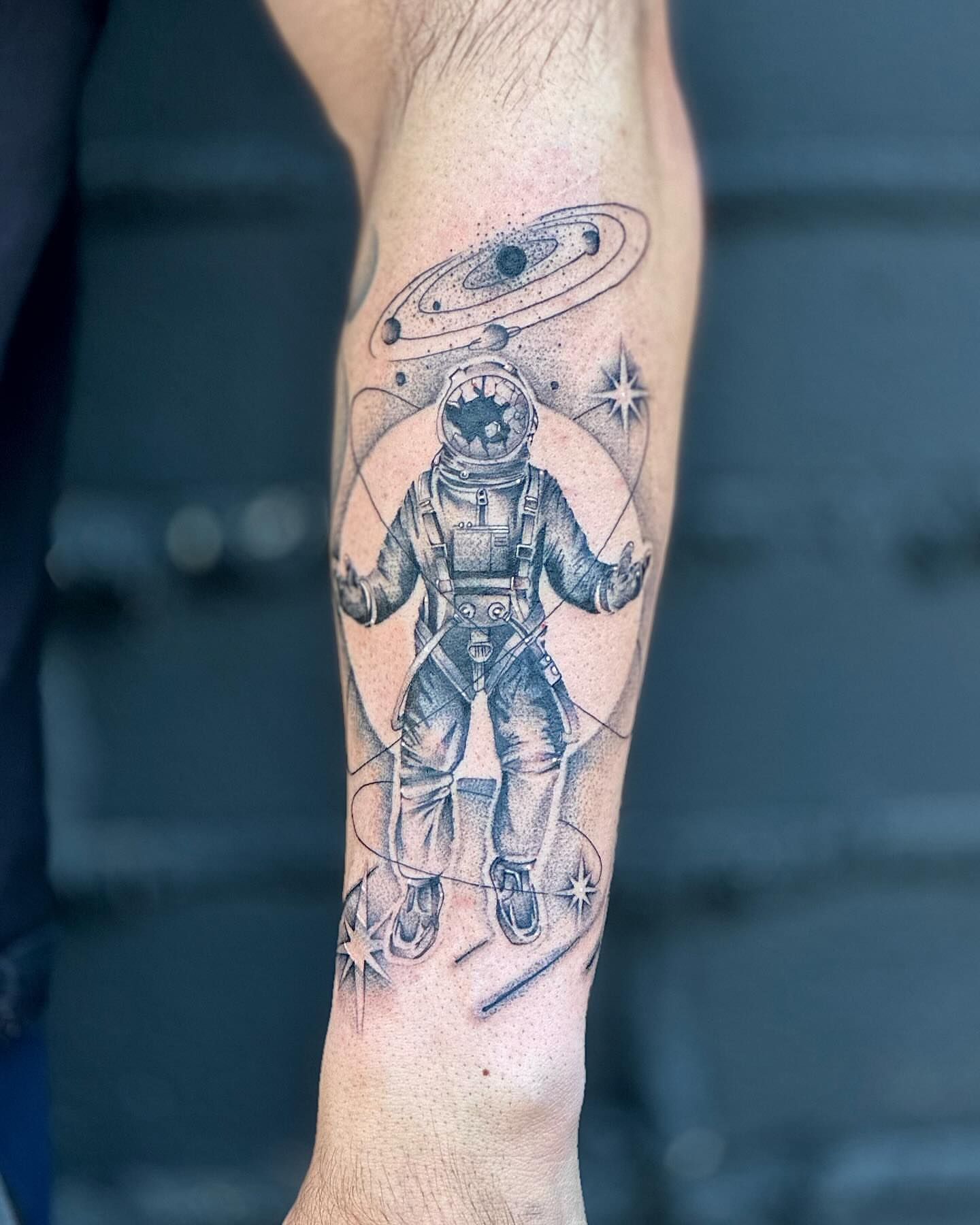 Astronaut dotwork tattoo on the forearm by Fine line tattoo San Diego, San Diego, California