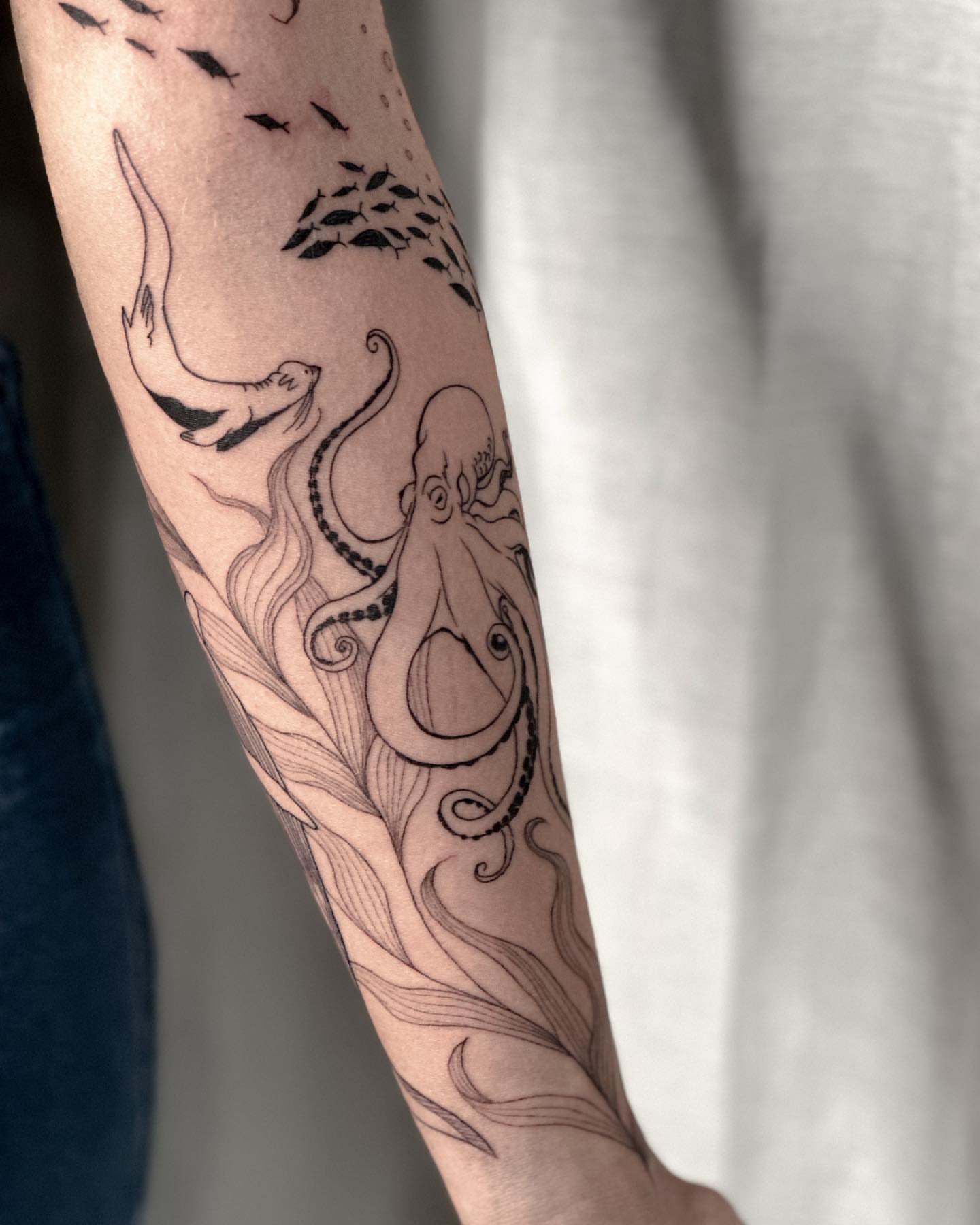 Octopus black and grey tattoo on the forearm by Liv