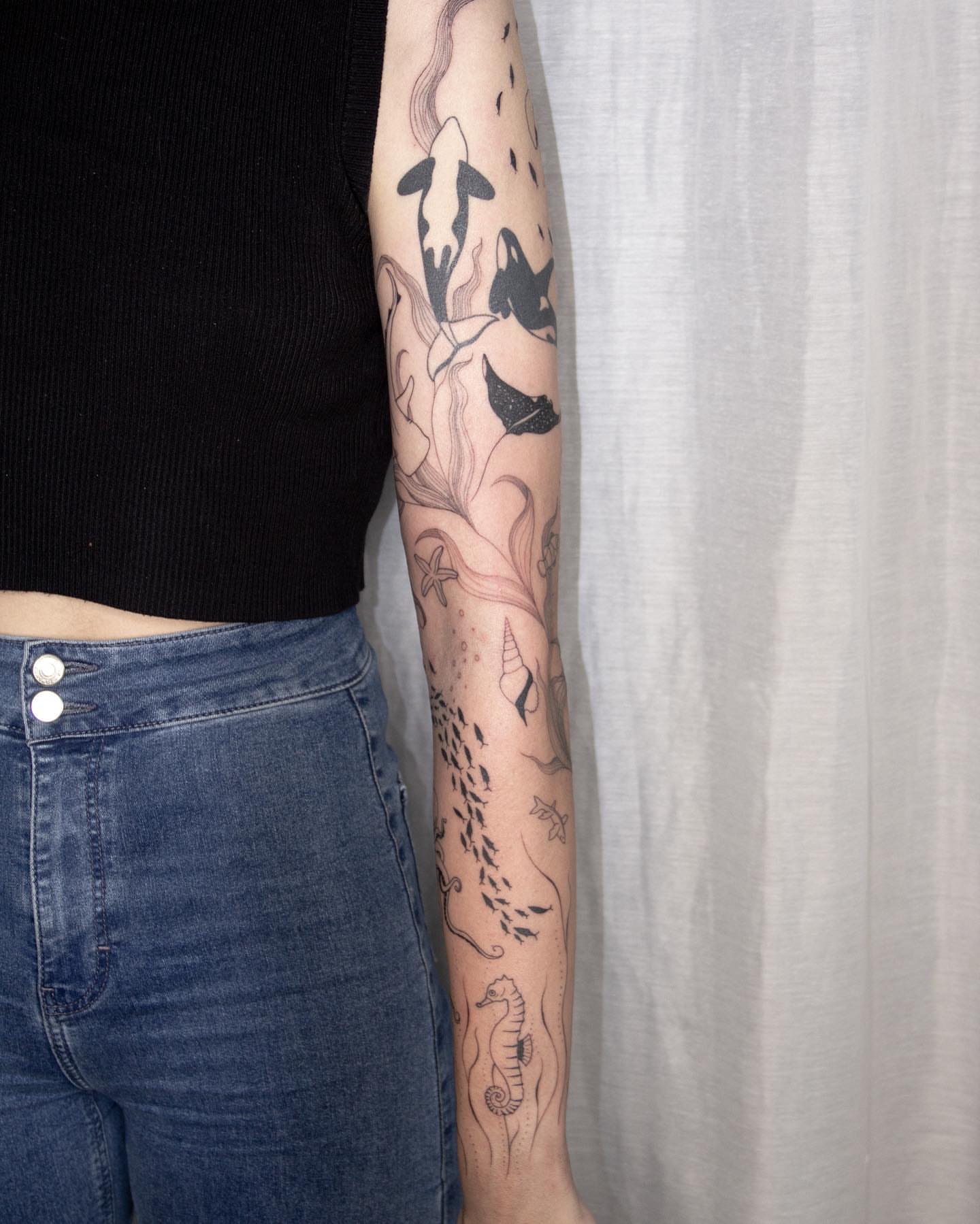 Underwater scene dotwork tattoo on the forearm by Liv