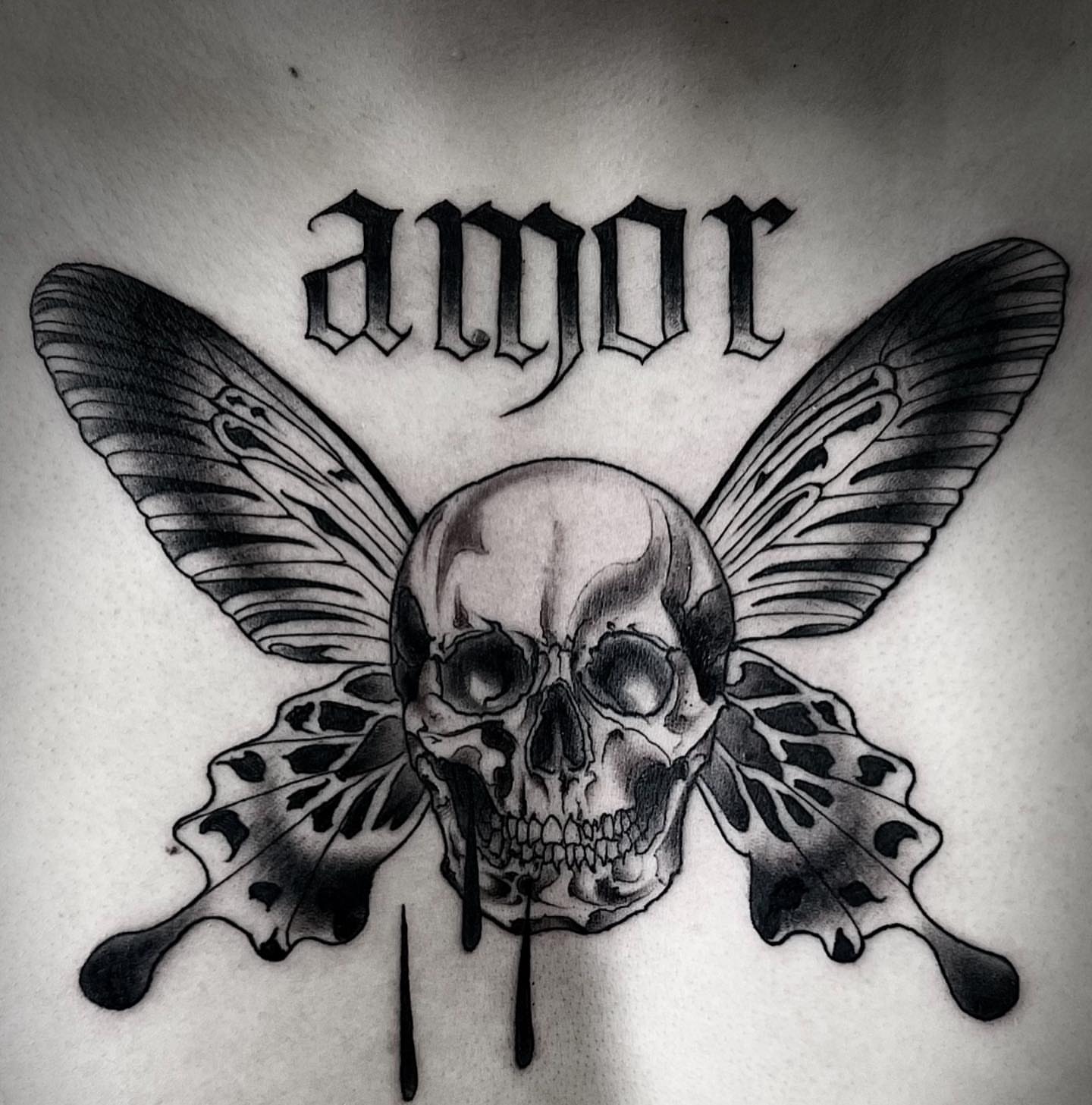 Skull with butterfly wings realism tattoo by Lorenzo Gomez, San Diego, California