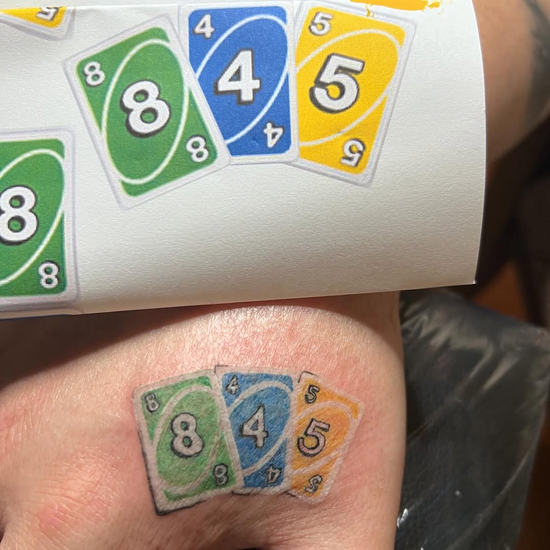 UNO cards new school tattoo on the chest by Lea-yae’