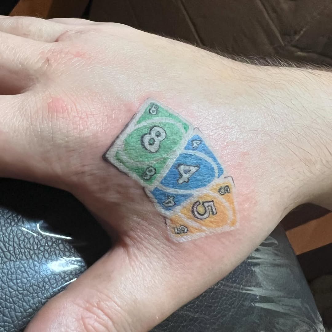 UNO cards new school tattoo on the forearm by Lea-yae’