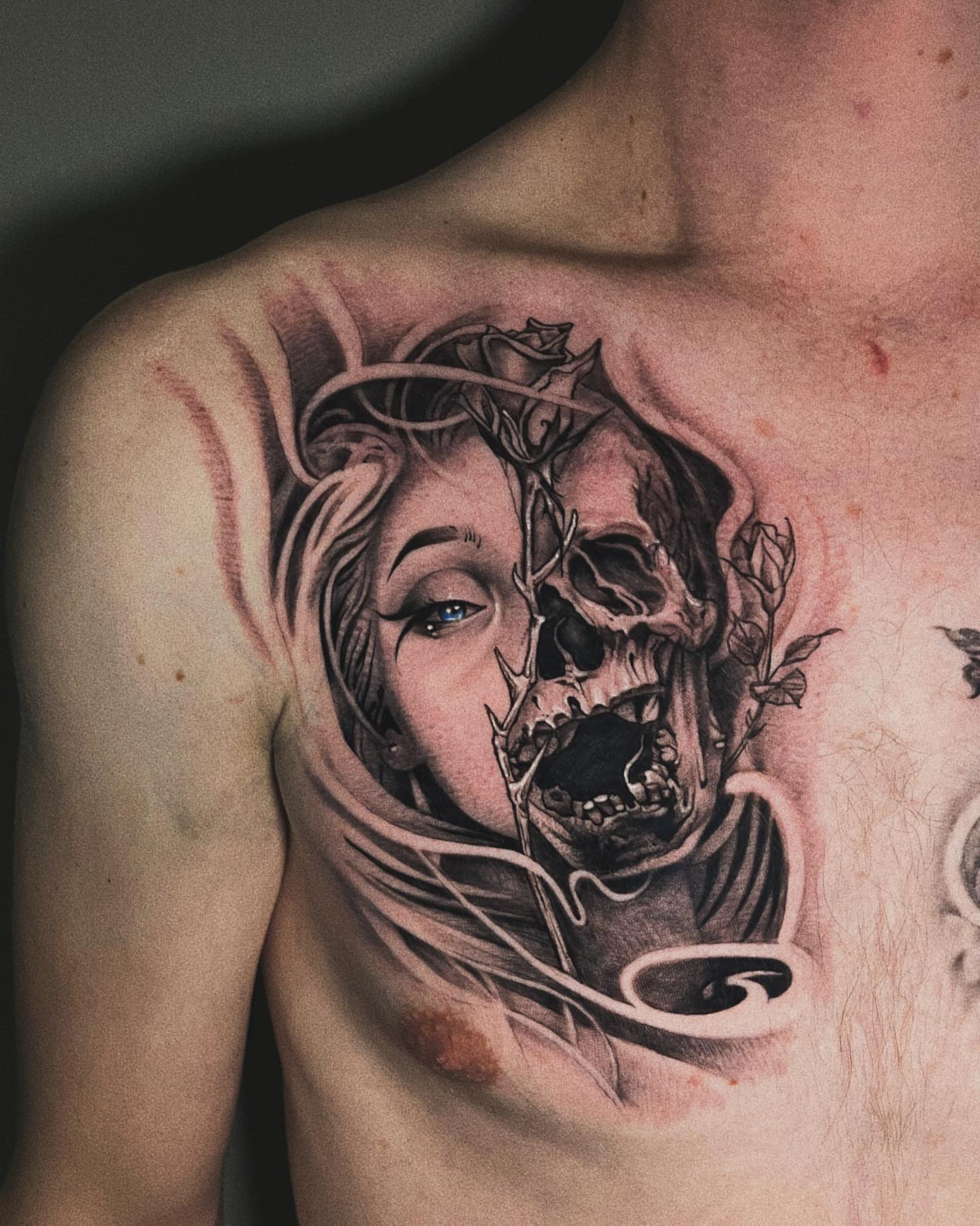 Woman with skull dark realism tattoo on the chest by Duo