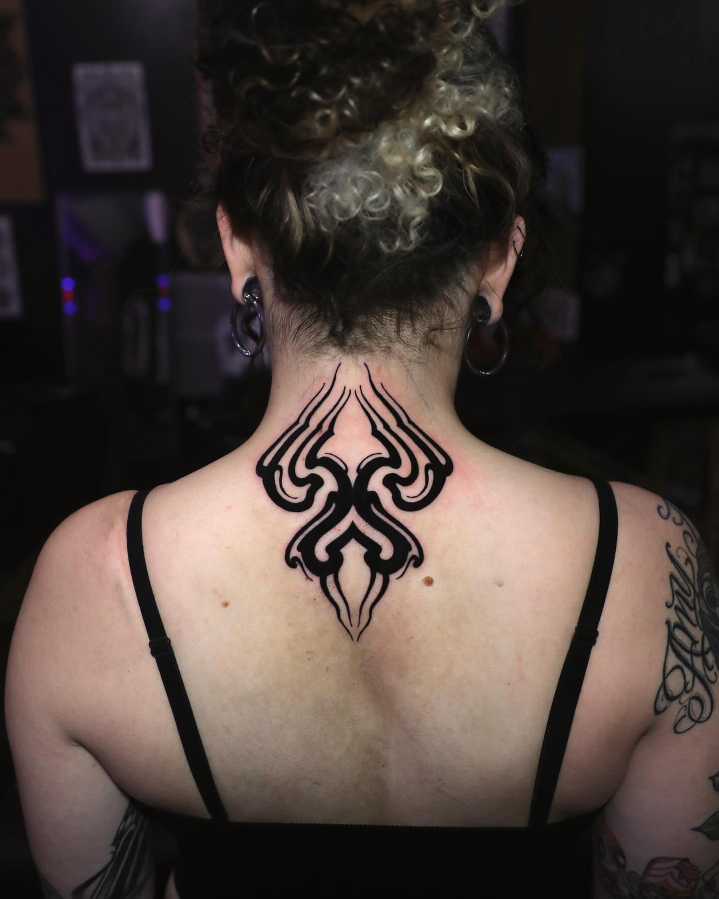 Tribal design tribal tattoo on the back by Diego Romay