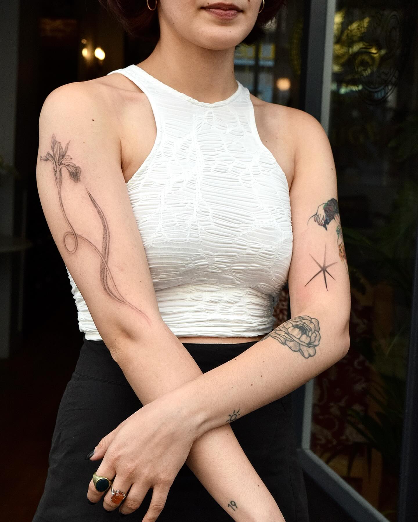 Flower and vine black and grey tattoo on the forearm by Stella Oh