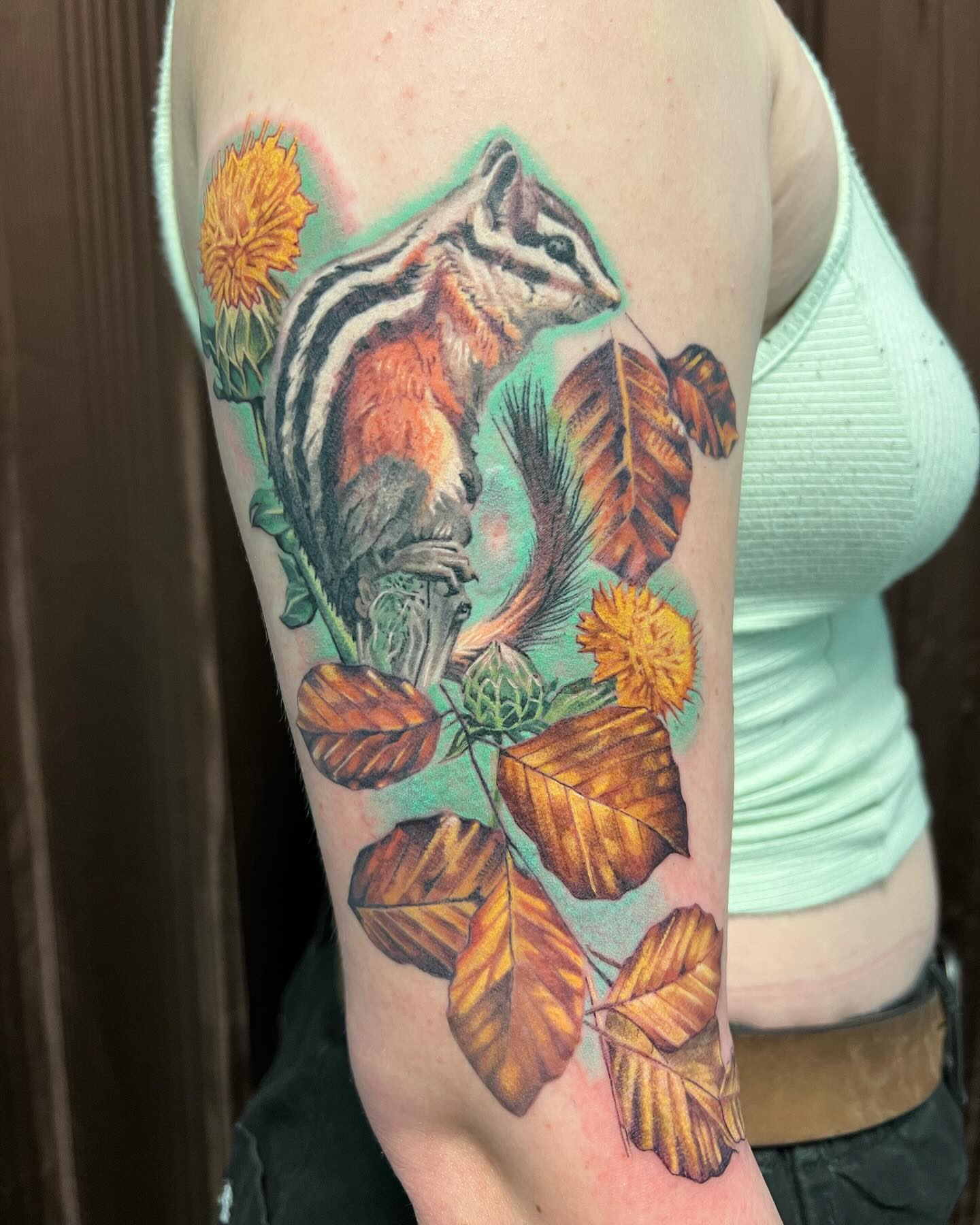 Chipmunk and leaves realism tattoo on the forearm by Irina Shapiro, Somerville, Massachusetts