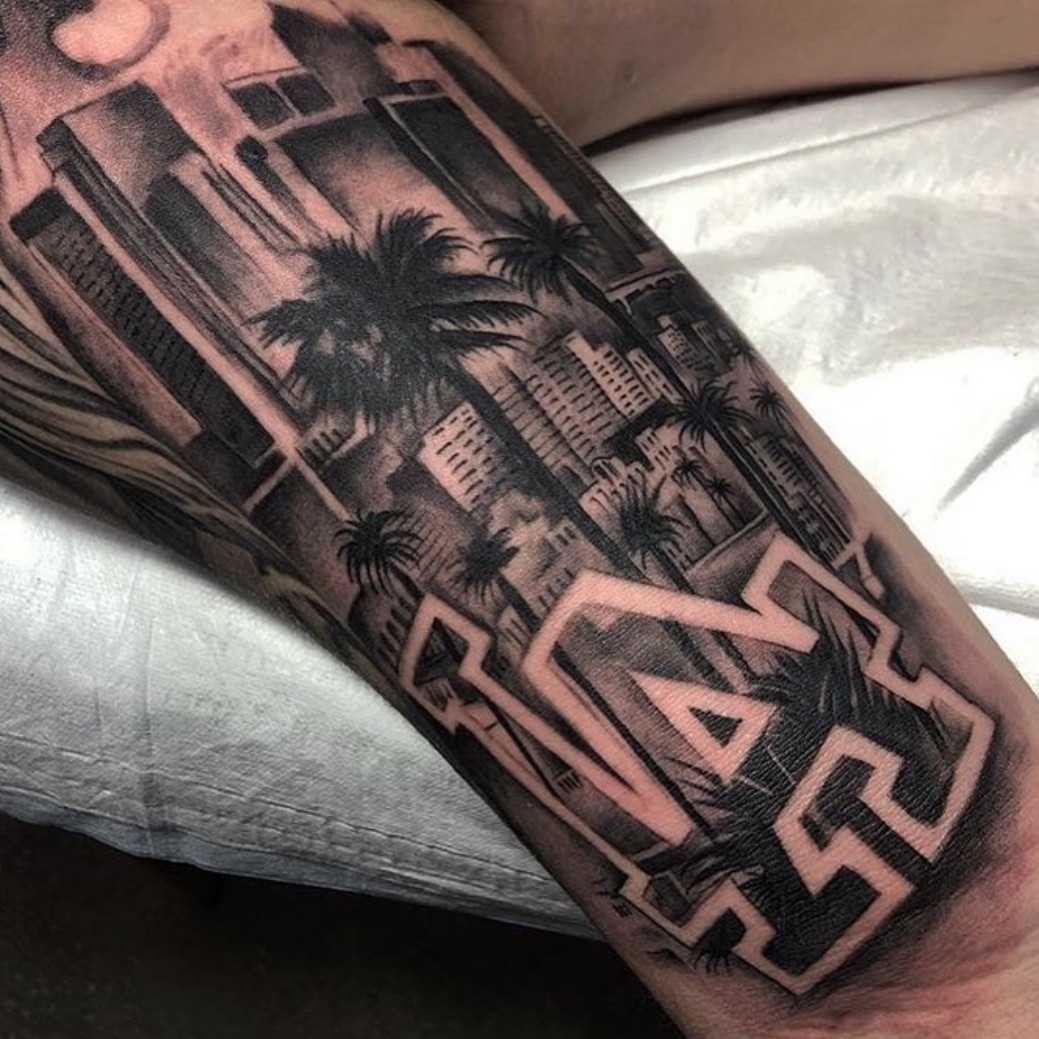 Cityscape geometric tattoo on the forearm by Chicanocustomlettering