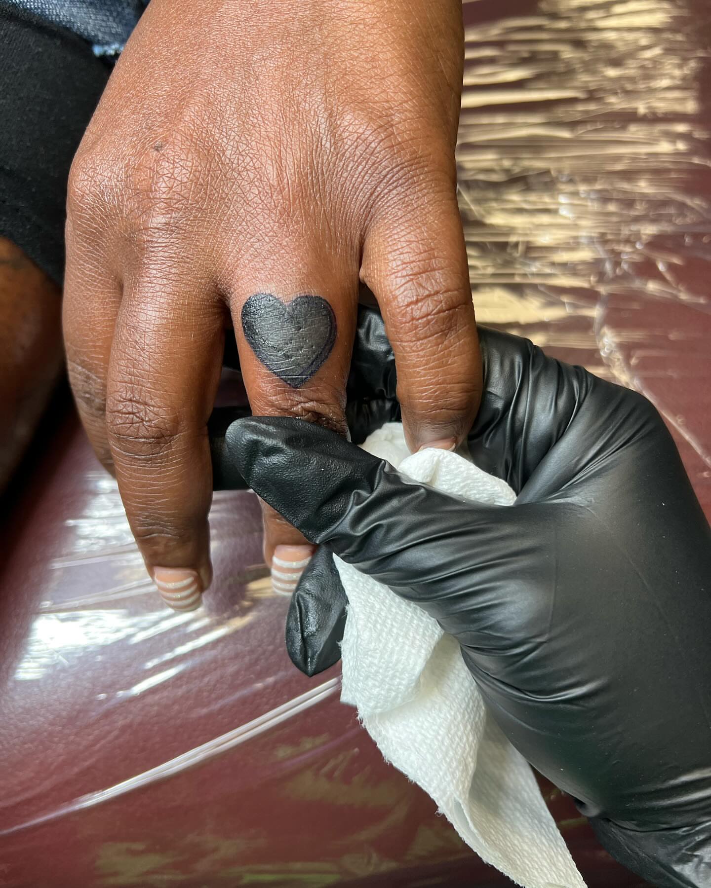 Heart black and grey tattoo on the hand by Kai