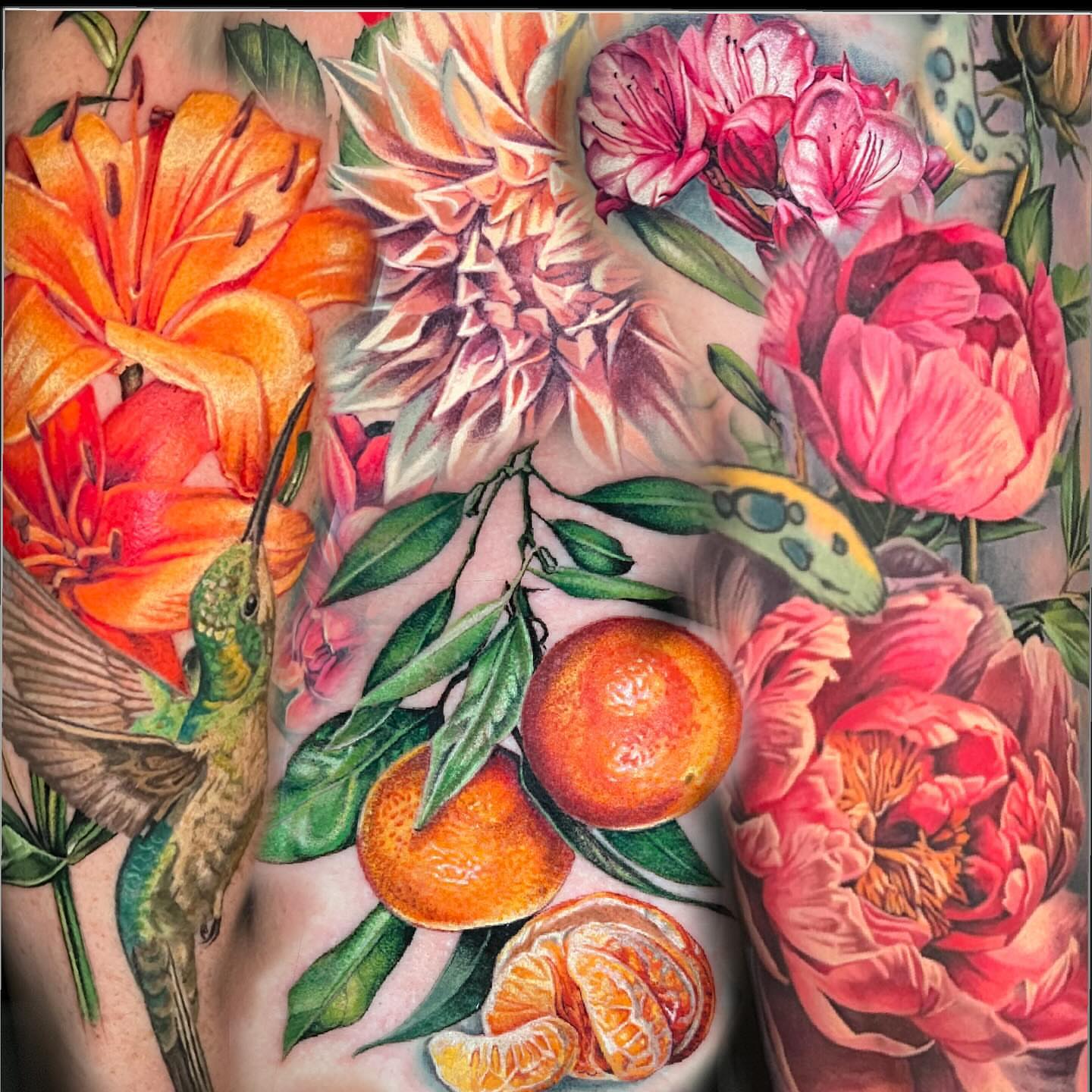 Floral arrangement with hummingbird realism tattoo on the torso by Irina Shapiro, Somerville, Massachusetts