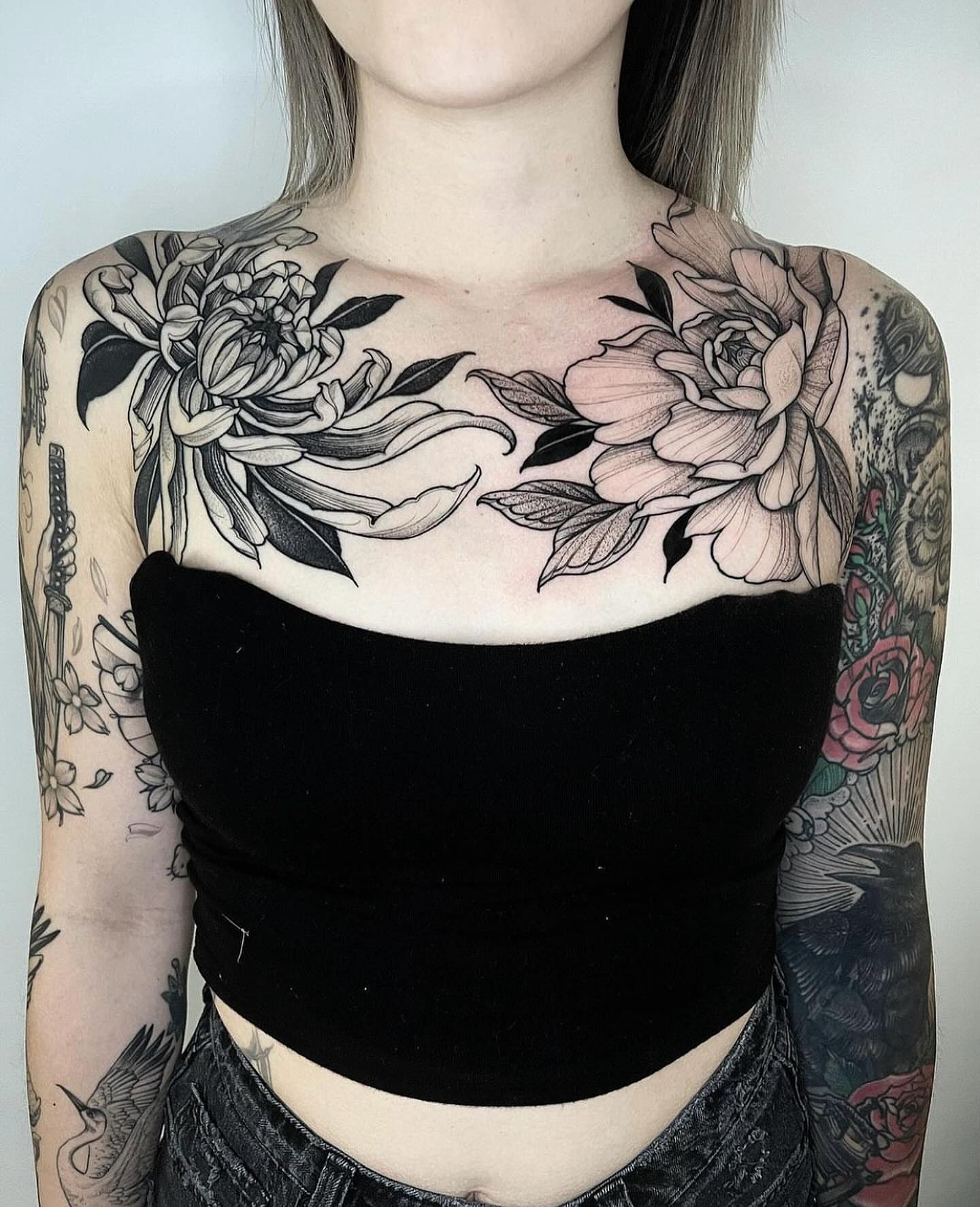Floral black and grey tattoo on the chest by Las Vegas Tattoo Artist