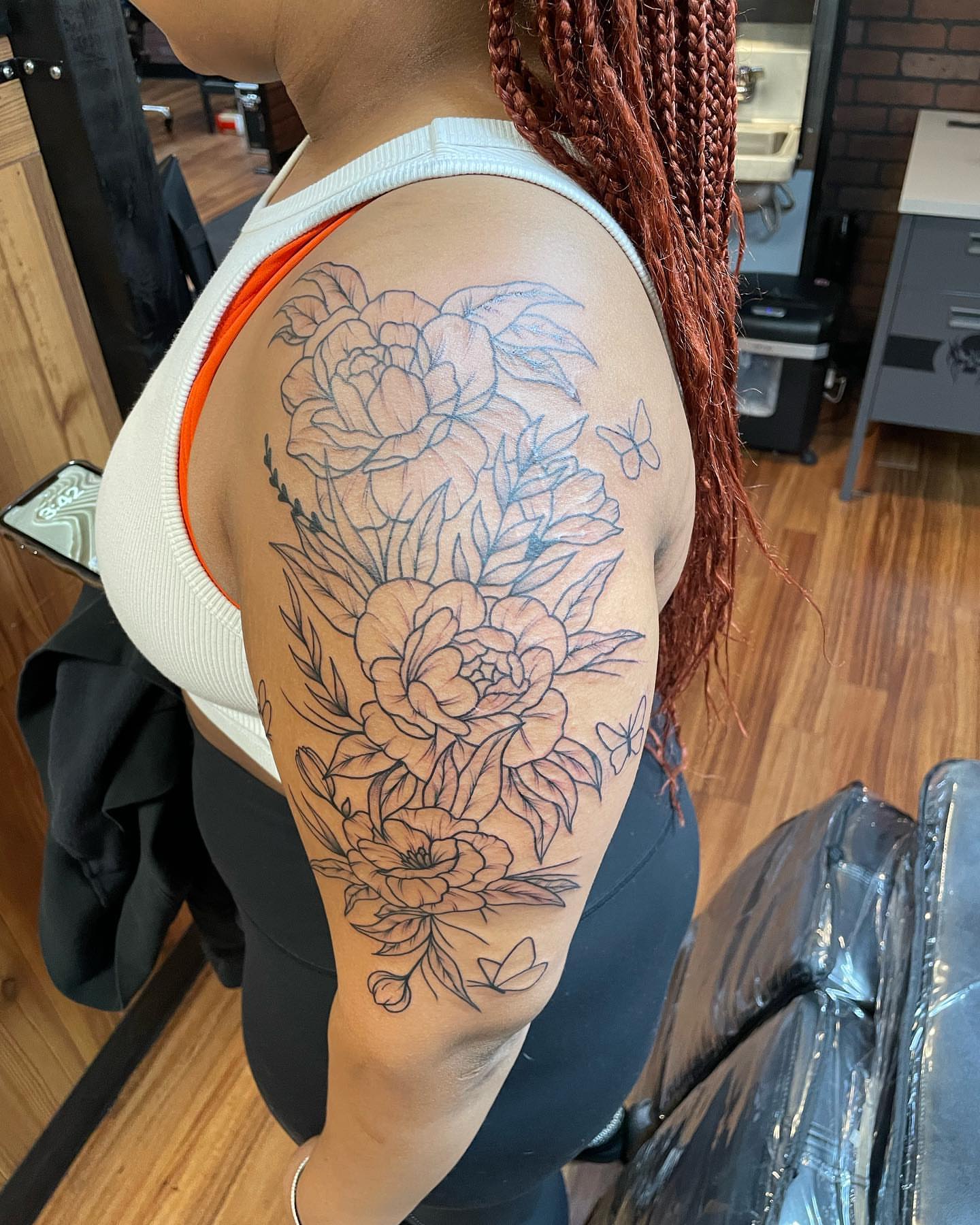 Floral bouquet black and grey tattoo on the shoulder by Anna sabrowsky