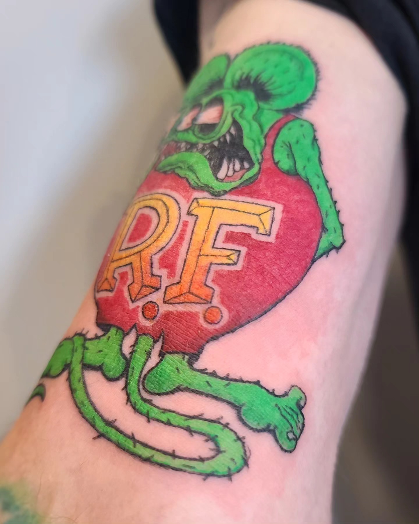 Green monster with heart American traditional tattoo on the forearm by ʙʀɪᴀɴɴᴀ 𝒁𝑶𝑴𝑩𝑹𝑰𝑬 ᴛᴀᴛᴛᴏᴏꜱ