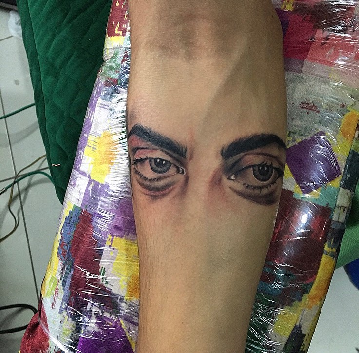 Eyes realism tattoo on the forearm by la flamme