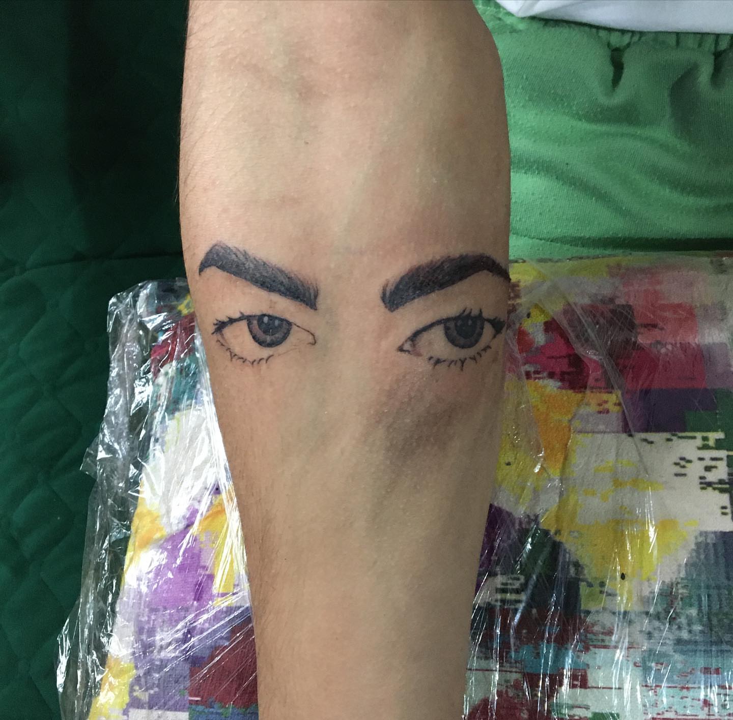 Eyes realism tattoo on the forearm by la flamme