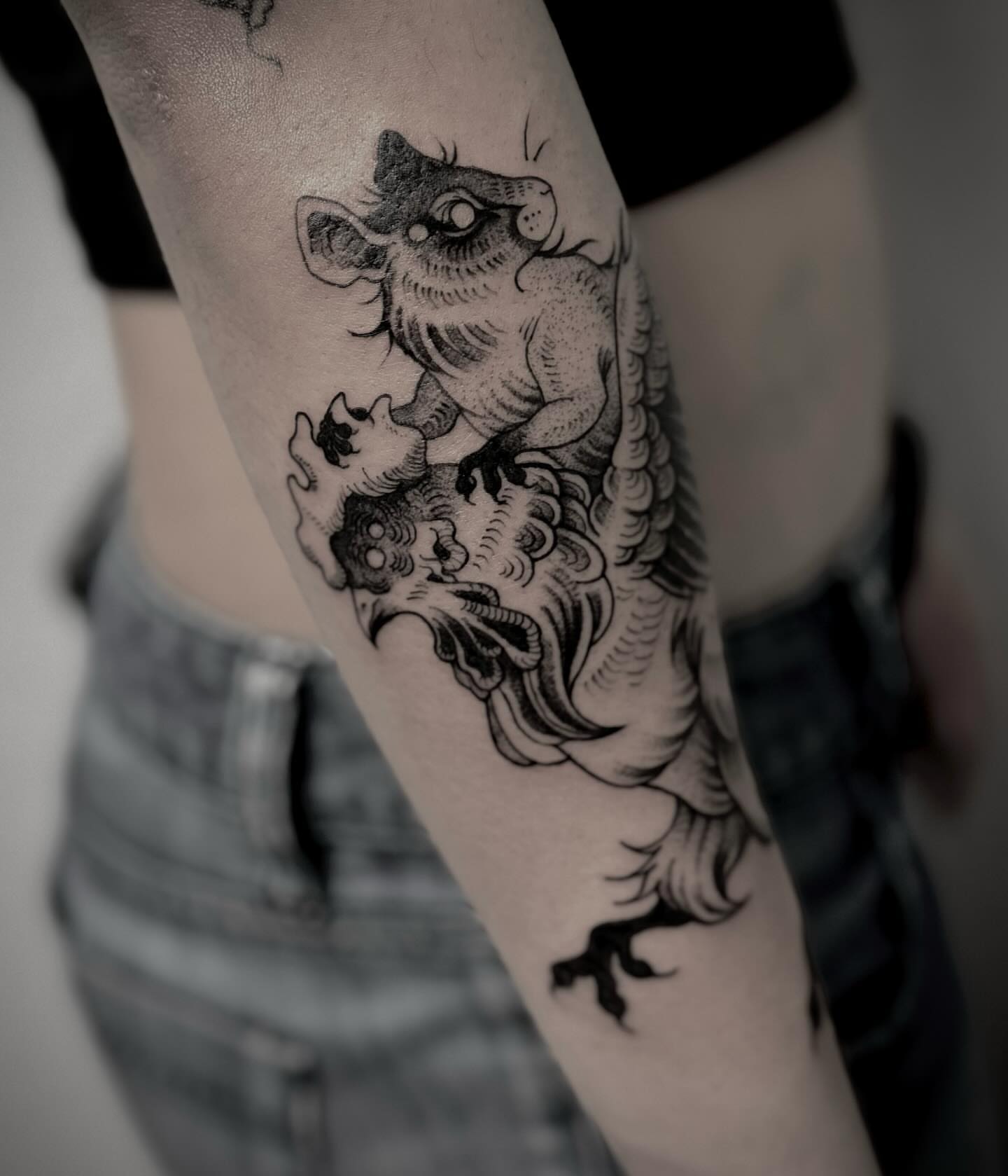 Lion black and grey tattoo on the forearm by Melanie