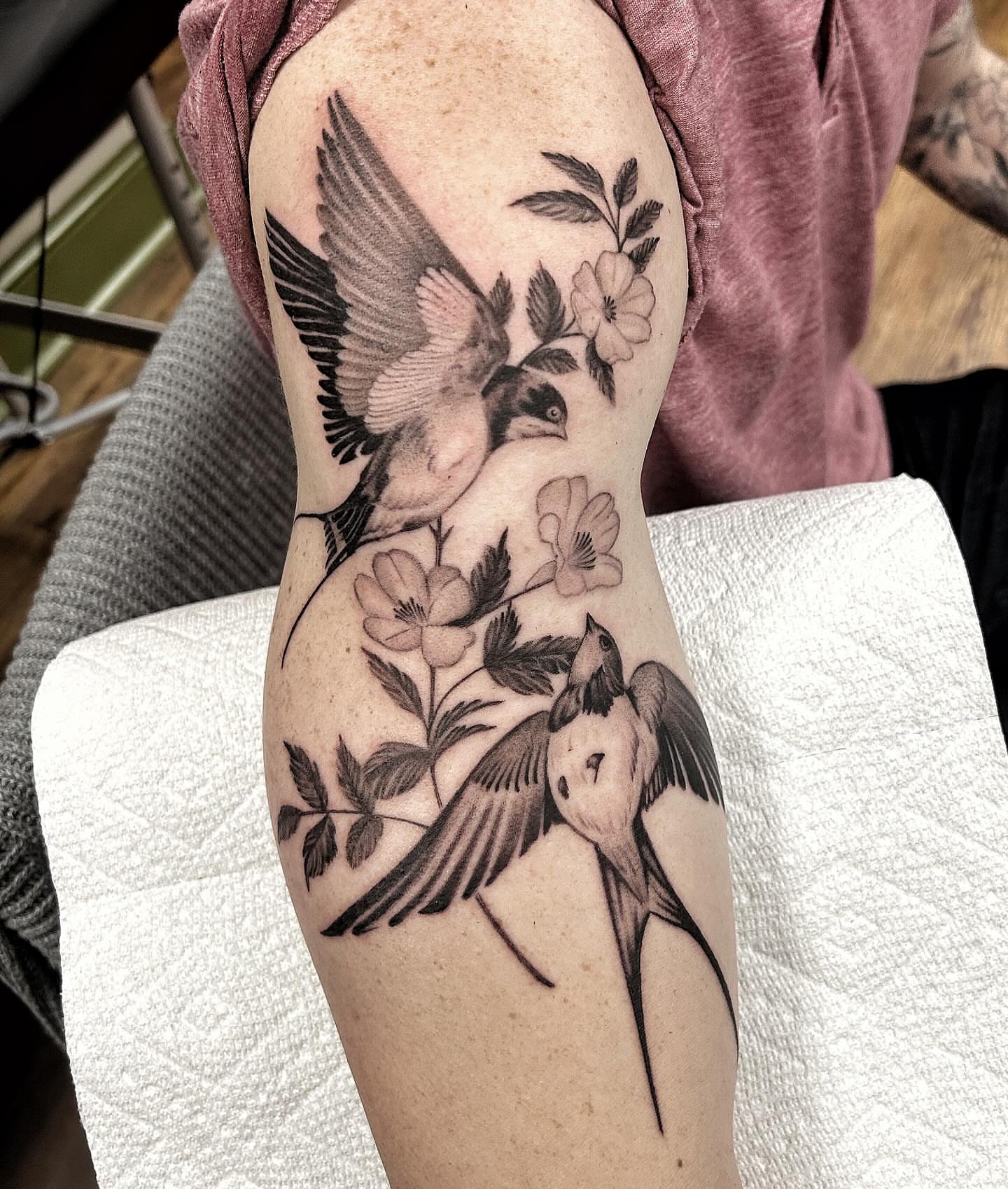 Birds and flowers realism tattoo on the forearm by Pat Moser