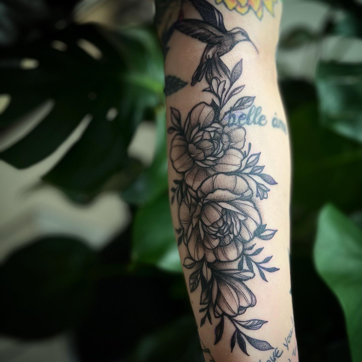 Peonies and hummingbird American traditional tattoo on the forearm by π΅πππππ