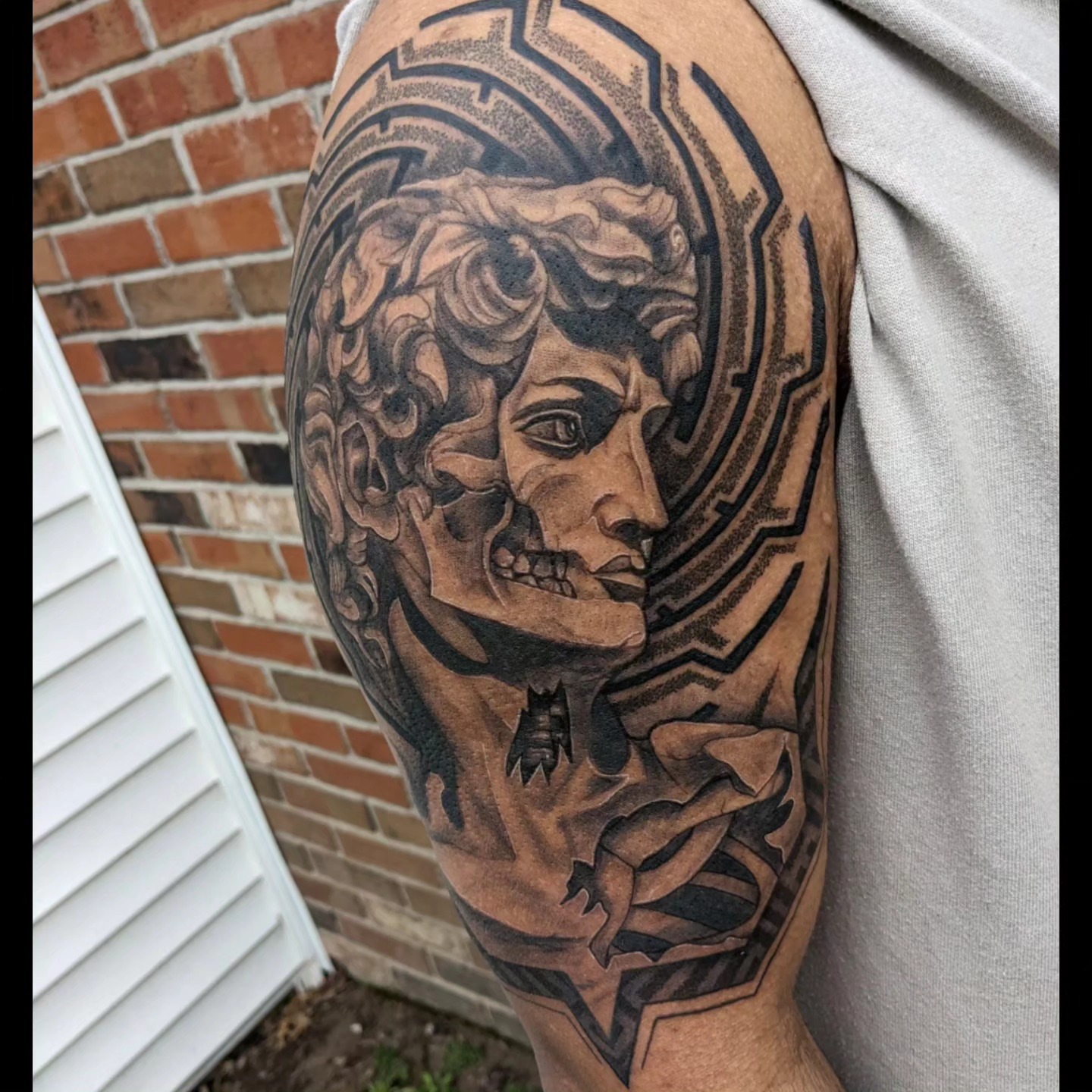 Medusa head realism tattoo on the shoulder by Ed Gonzalez