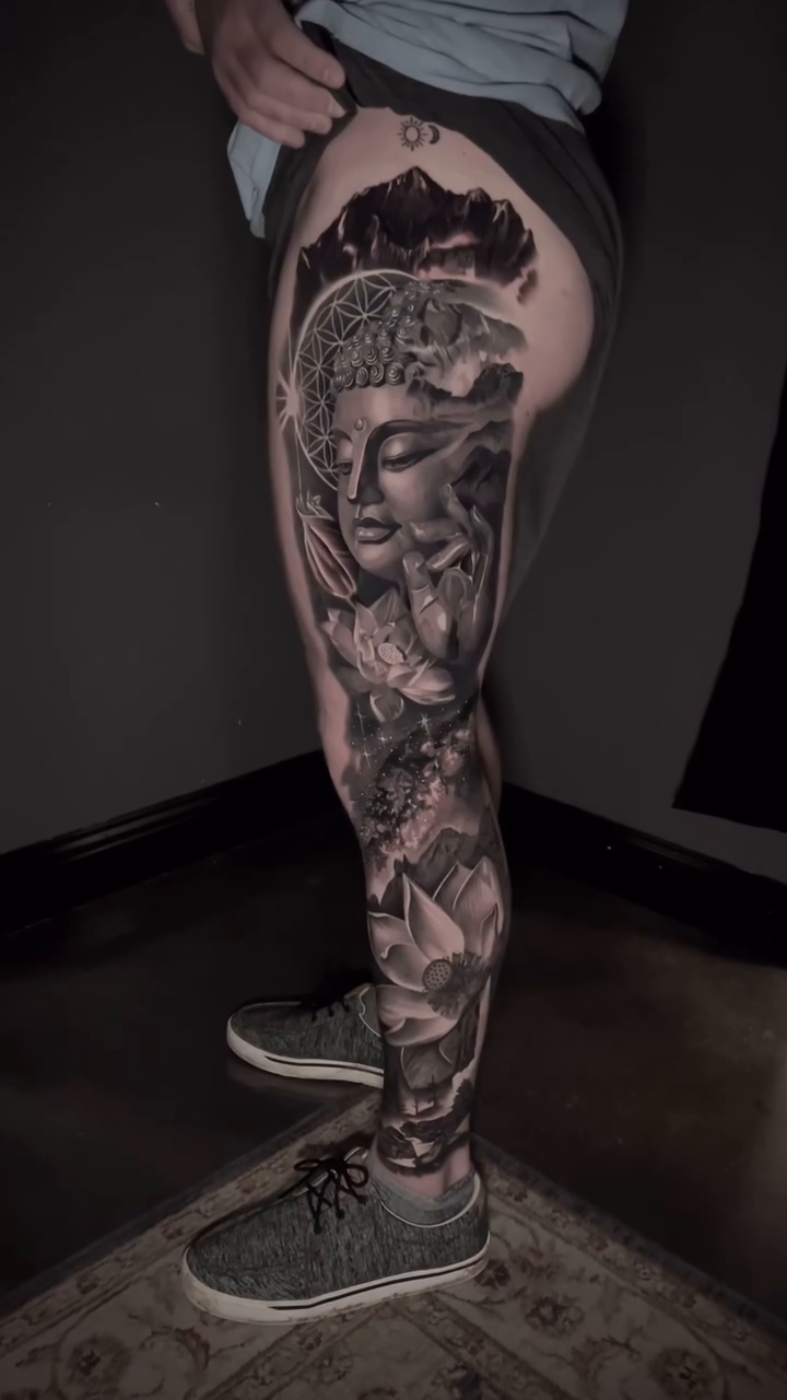 Buddha and lotus flowers realism tattoo by Travis Chick
