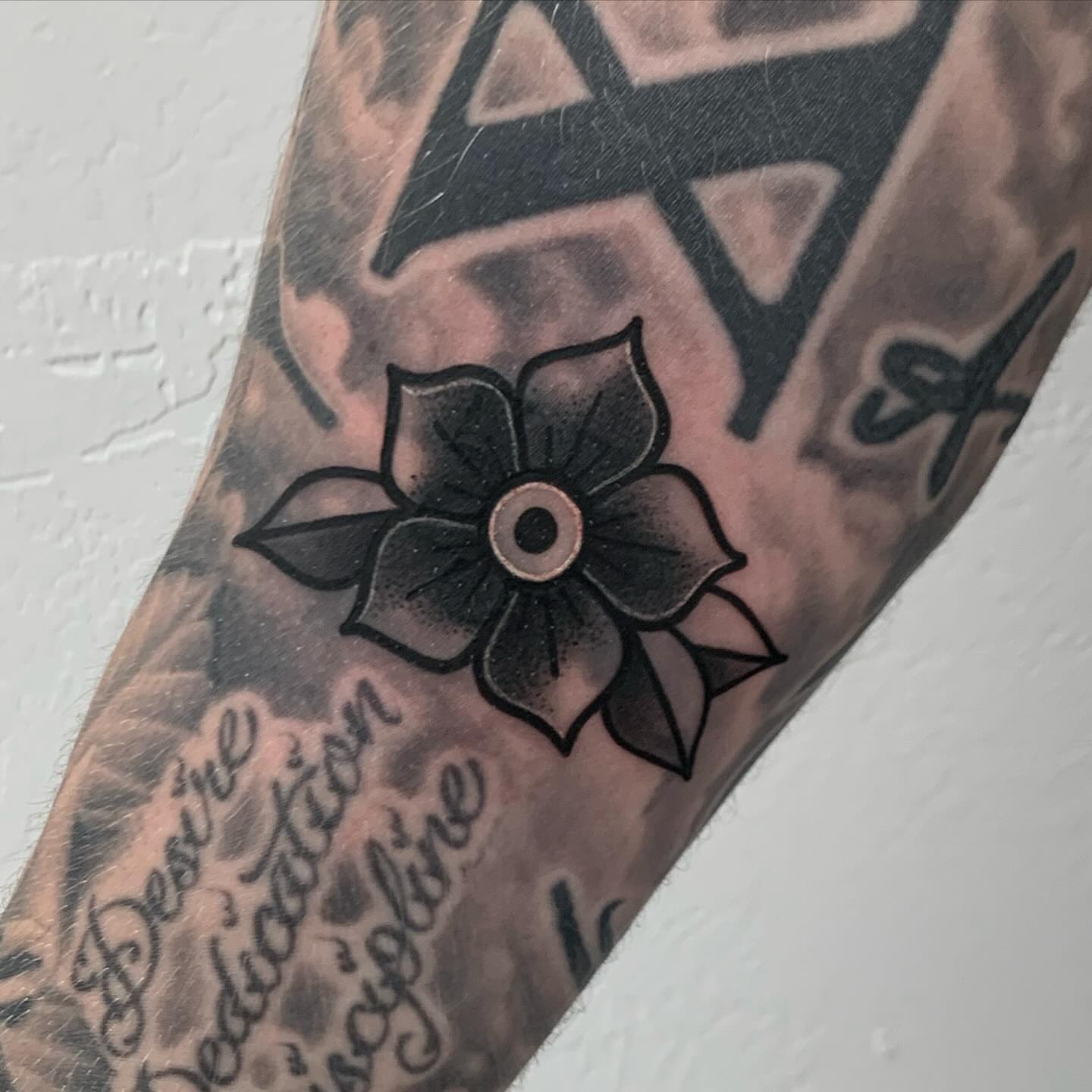 Flower black and grey tattoo on the forearm by Winters Ashurst - St. George tattoo artist