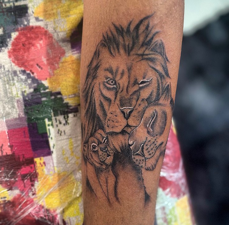 Lion and cub realism tattoo on the forearm by la flamme