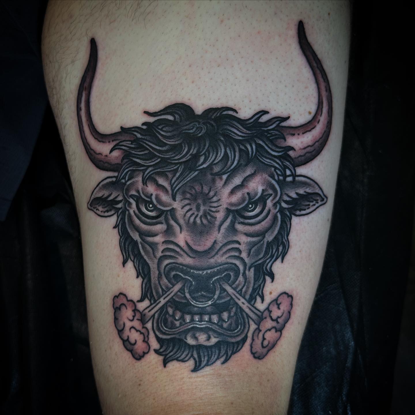 Bull head black and grey tattoo on the thigh by Bryan Humphries