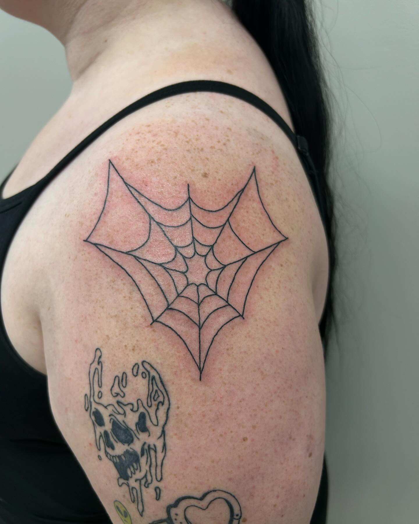 Spider web geometric tattoo on the shoulder by 𝕯𝖆𝖓𝖎