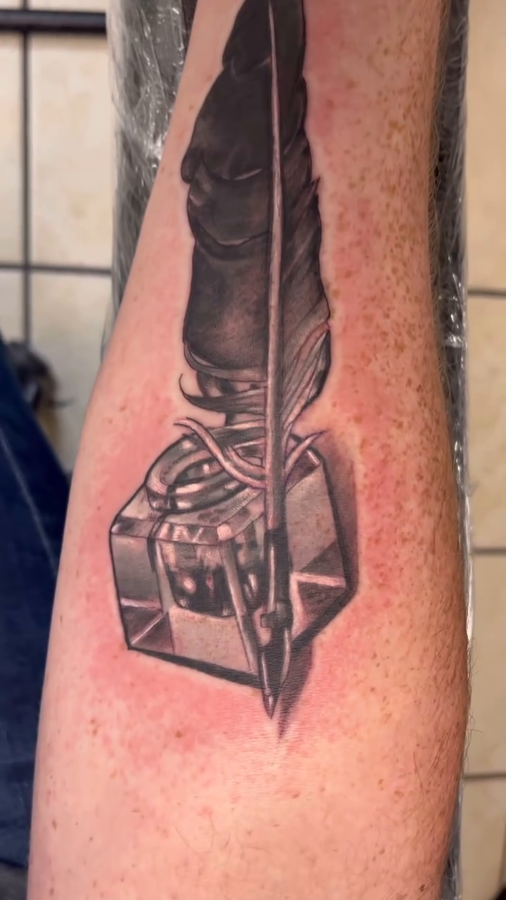 Feather quill and inkwell realism tattoo by Look