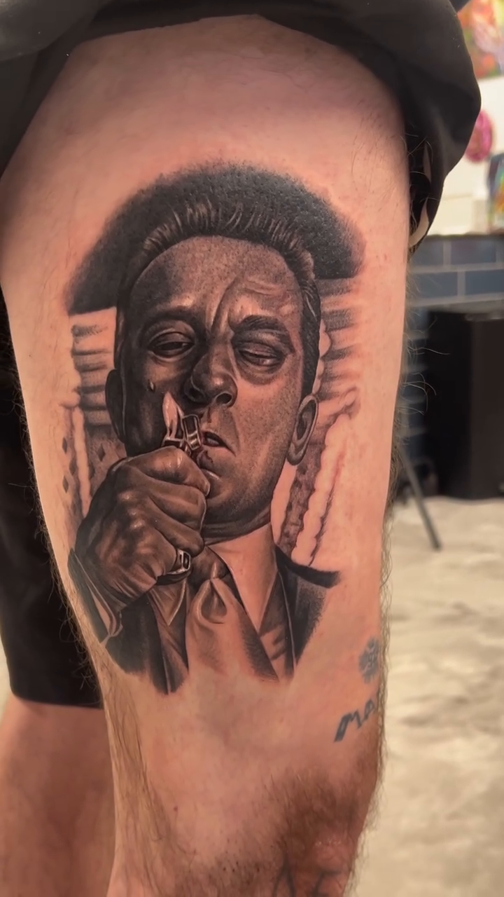 Portrait of a man smoking realism tattoo by Andrew Wine🍷Tattoo