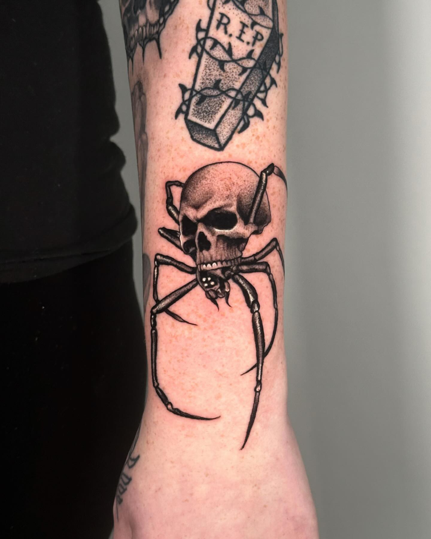 Skull spider dotwork tattoo on the forearm by Jesse Reip, Lakewood, Ohio