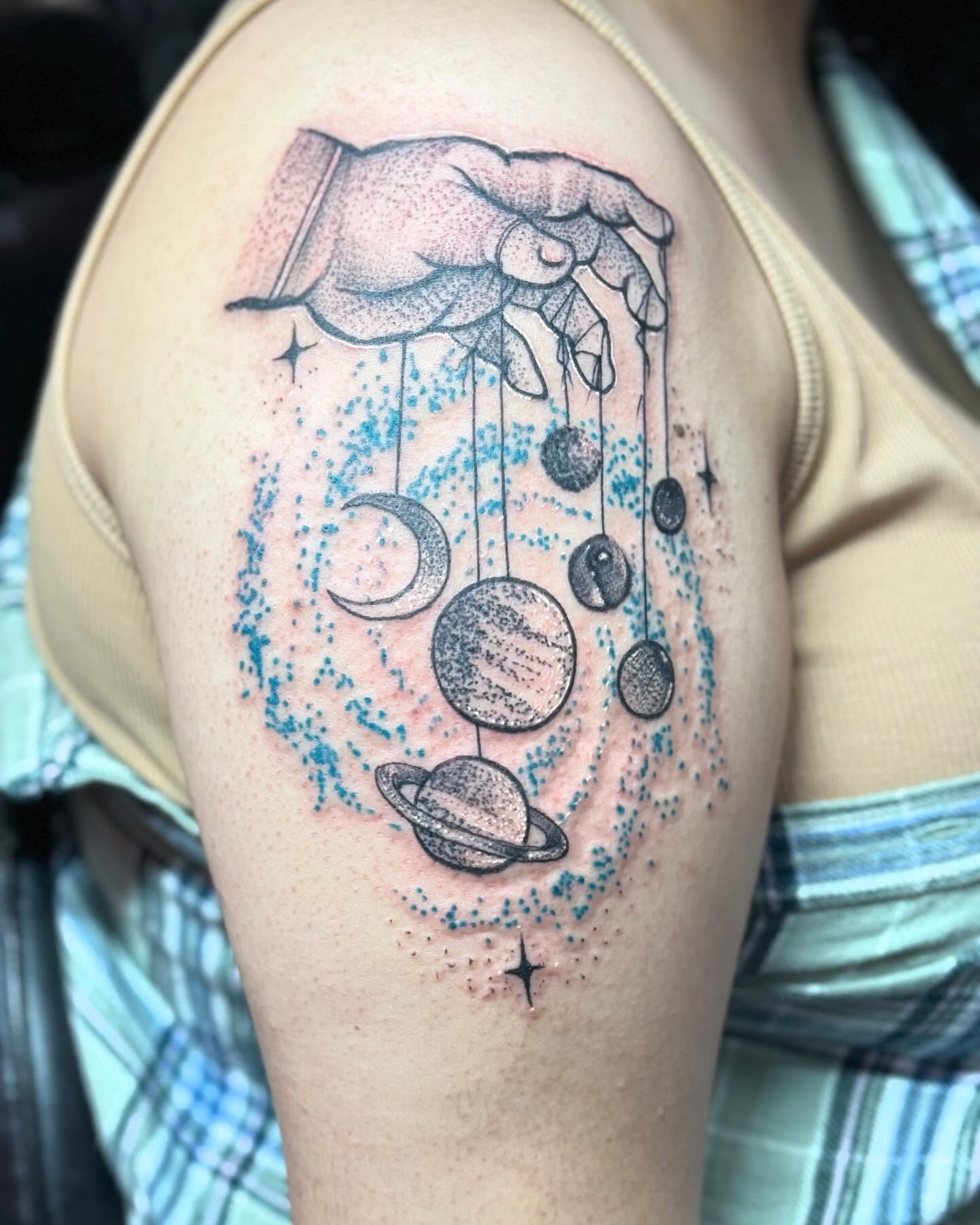 Planets and stars dotwork tattoo on the shoulder by Alejandro Zaragoza